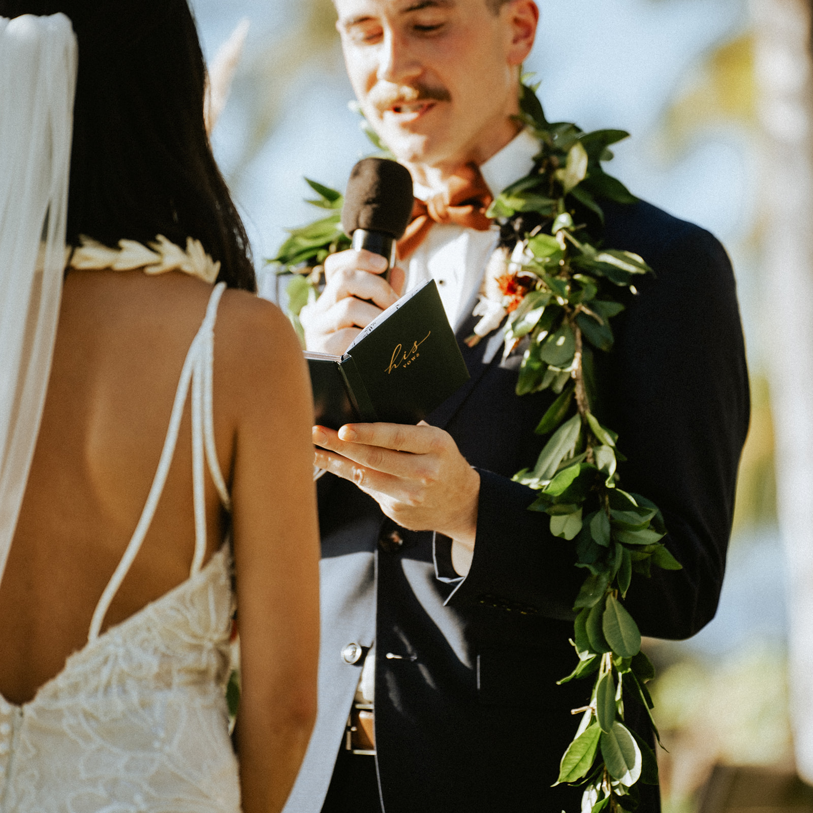 Bride and groom recite their vows at Lanikuhonua on a sunny day