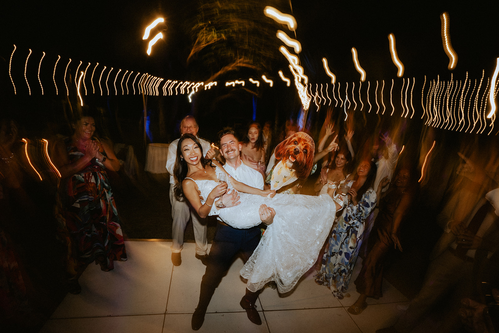 Groom and Bride celebrate with their loved ones on the dance floor at Lanikuhonua