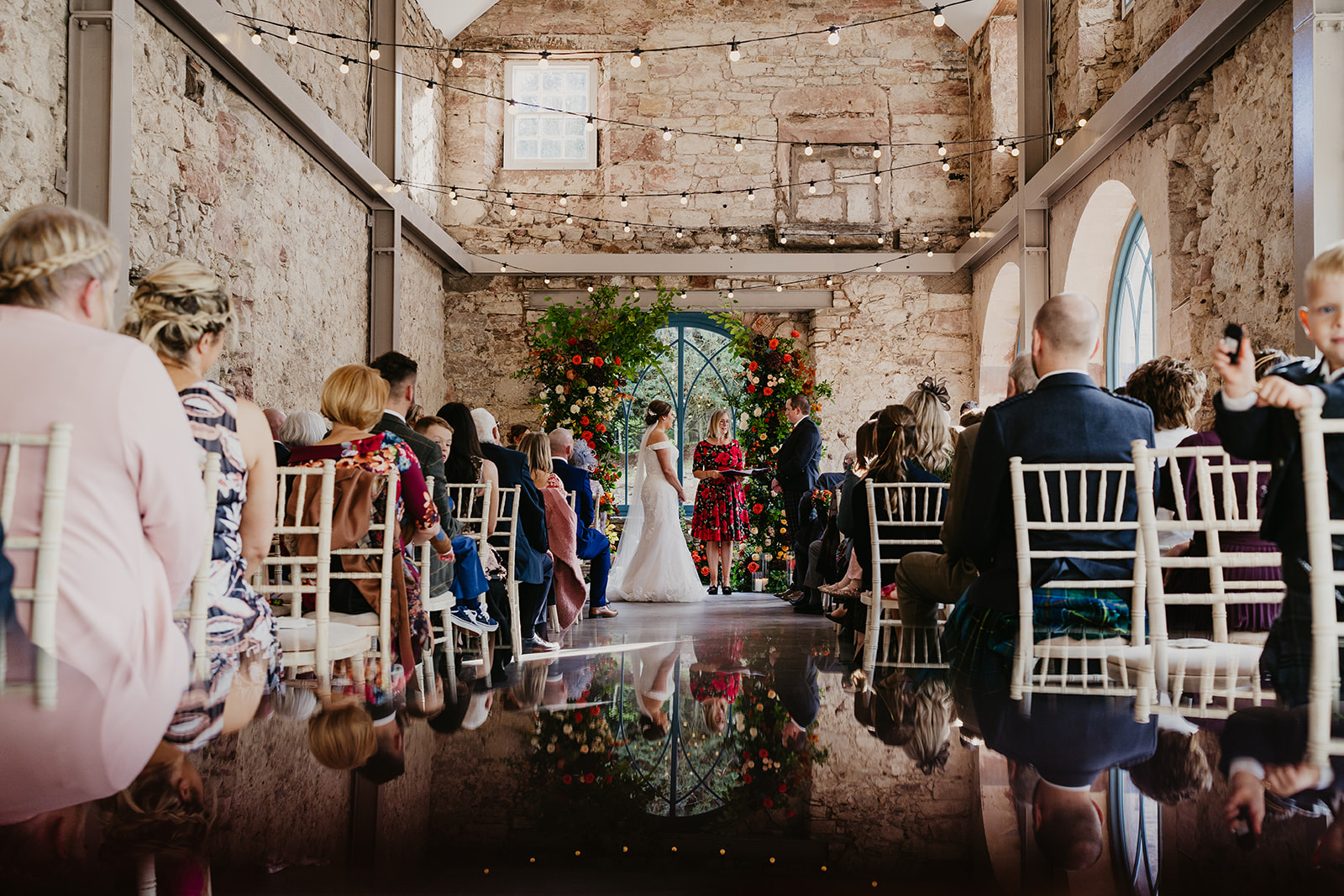 The stunning ceremony space at Broxmouth Courtyard flowers by Wild Flowers Edinburgh