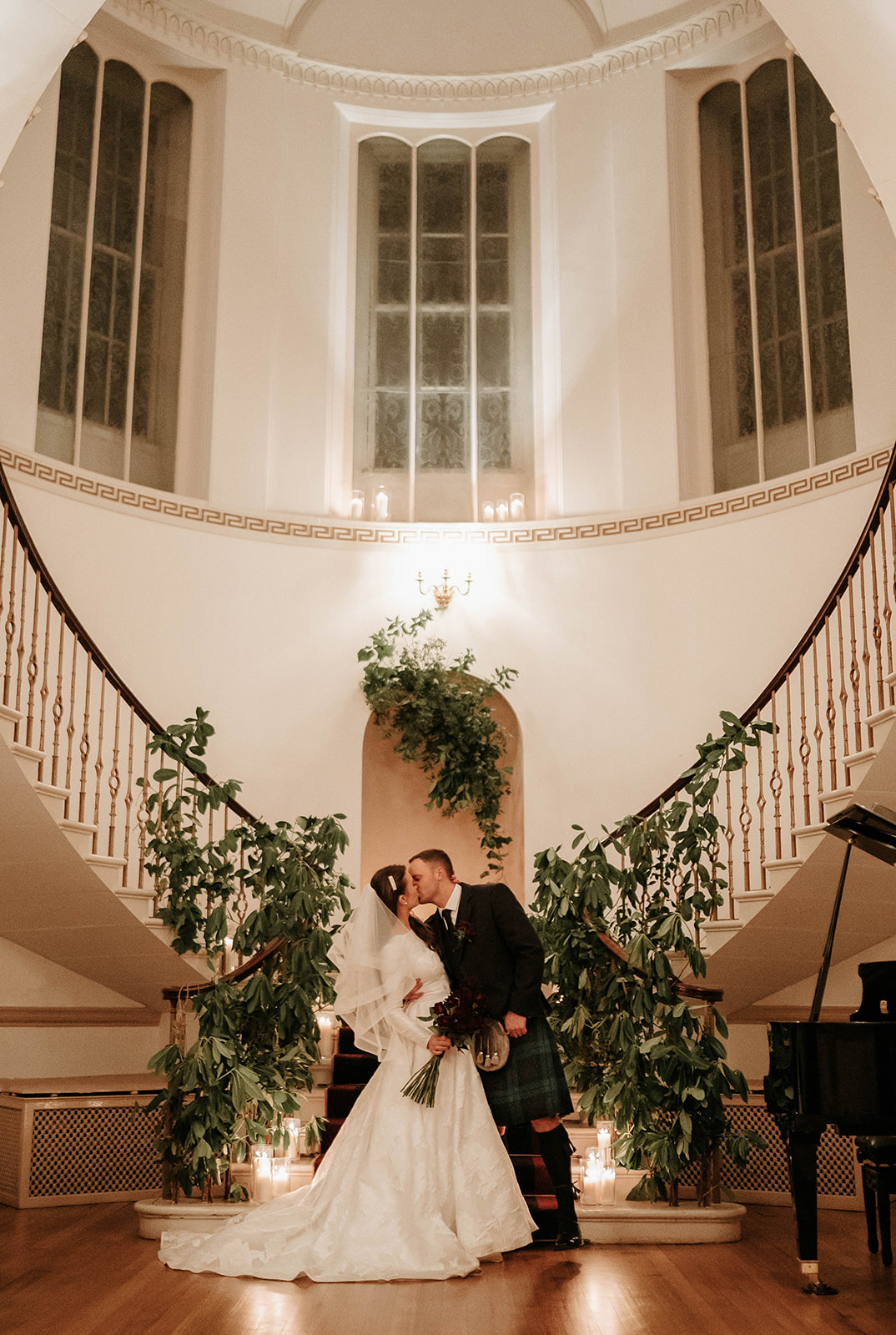 A couple infront of the grand staircase at Fasque House