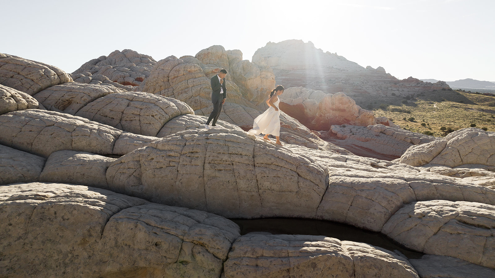 Couple walking on the "doomes" at White Pocket Arizona 