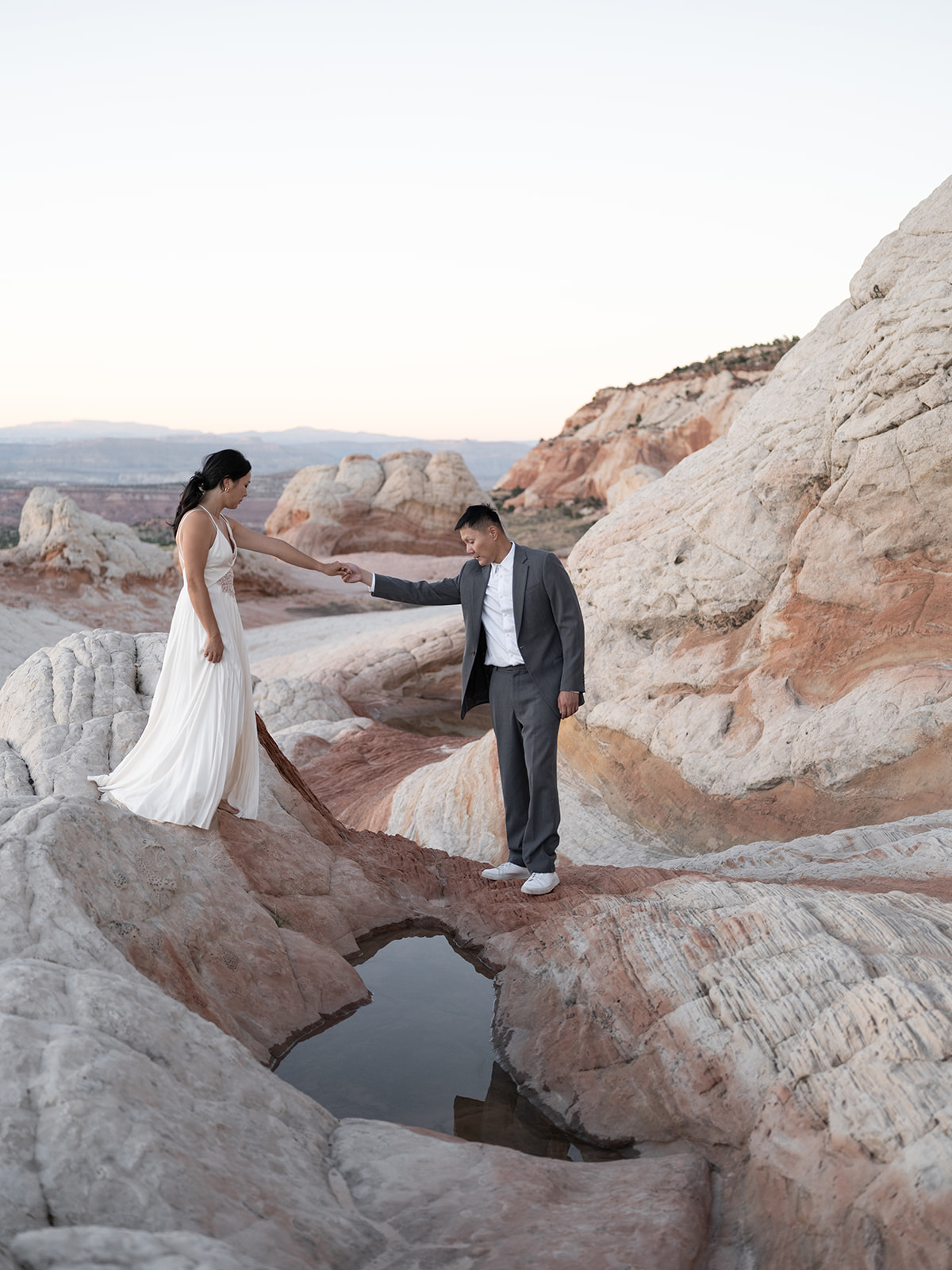 Couple exploring amazing locations in White Pocket Arizona during their Elopement 
