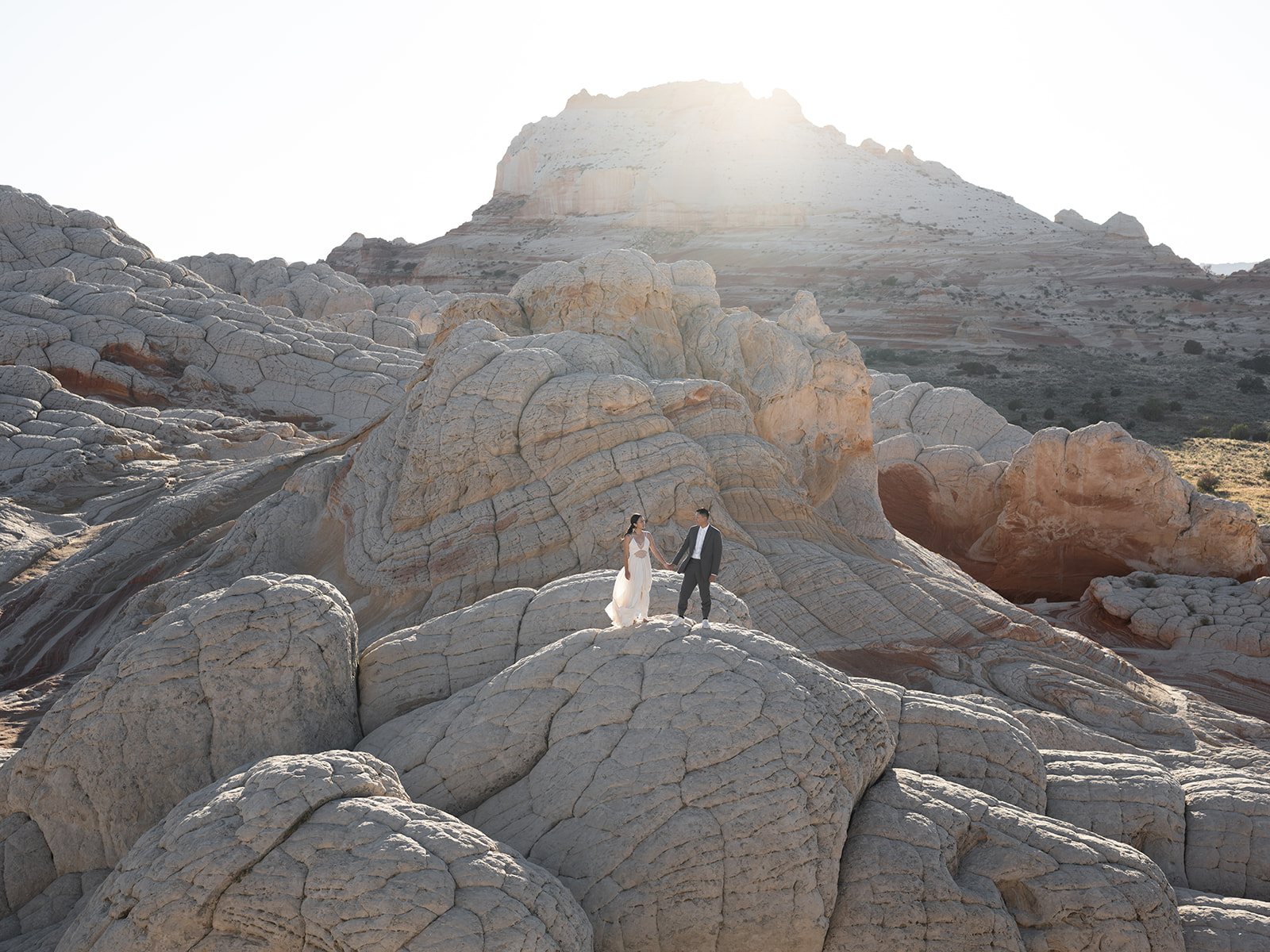 Eloping in the secluded and remote location of White Pocket, Arizona with beautiful views of the Vermilion Cliffs