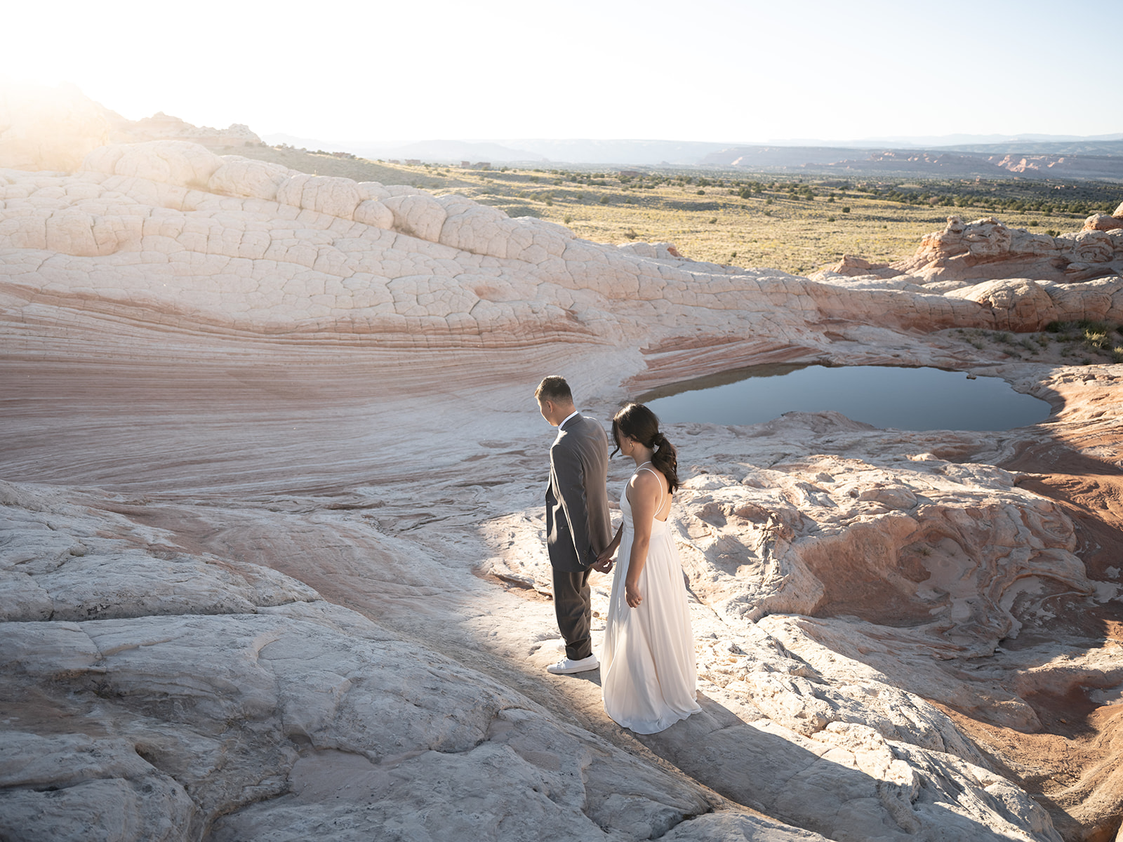 Couple exploring White Pocket Arizona during their Elopement