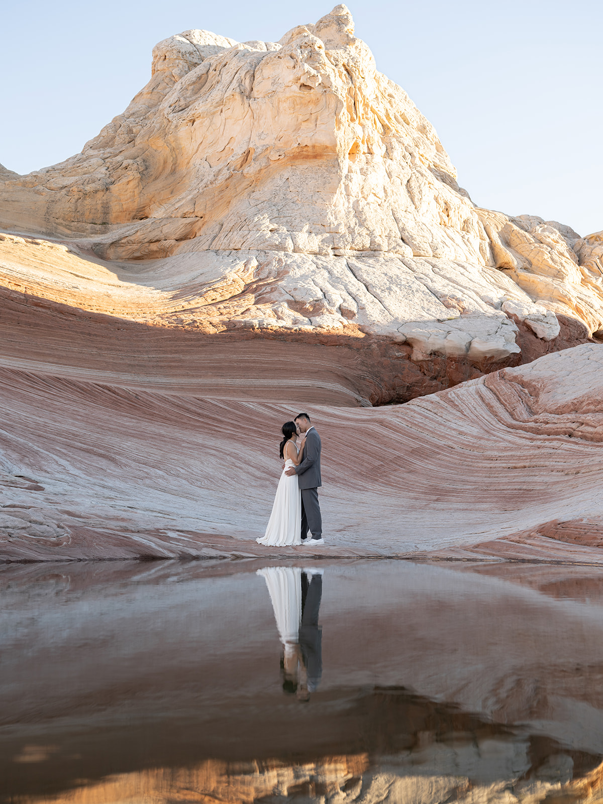 Couple finds the perfect reflections spot during the White Pocket Arizona Elopement 