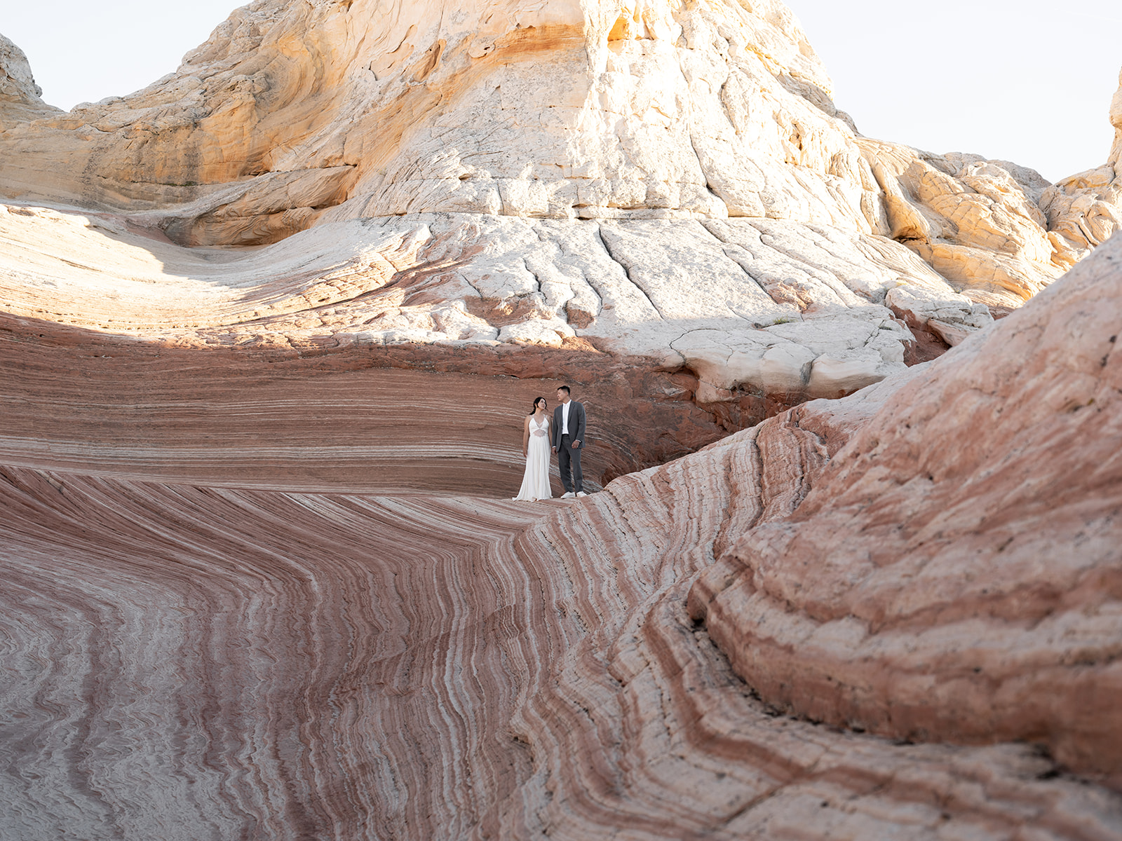 Couple eloping in a spot that looks like the "wave" 