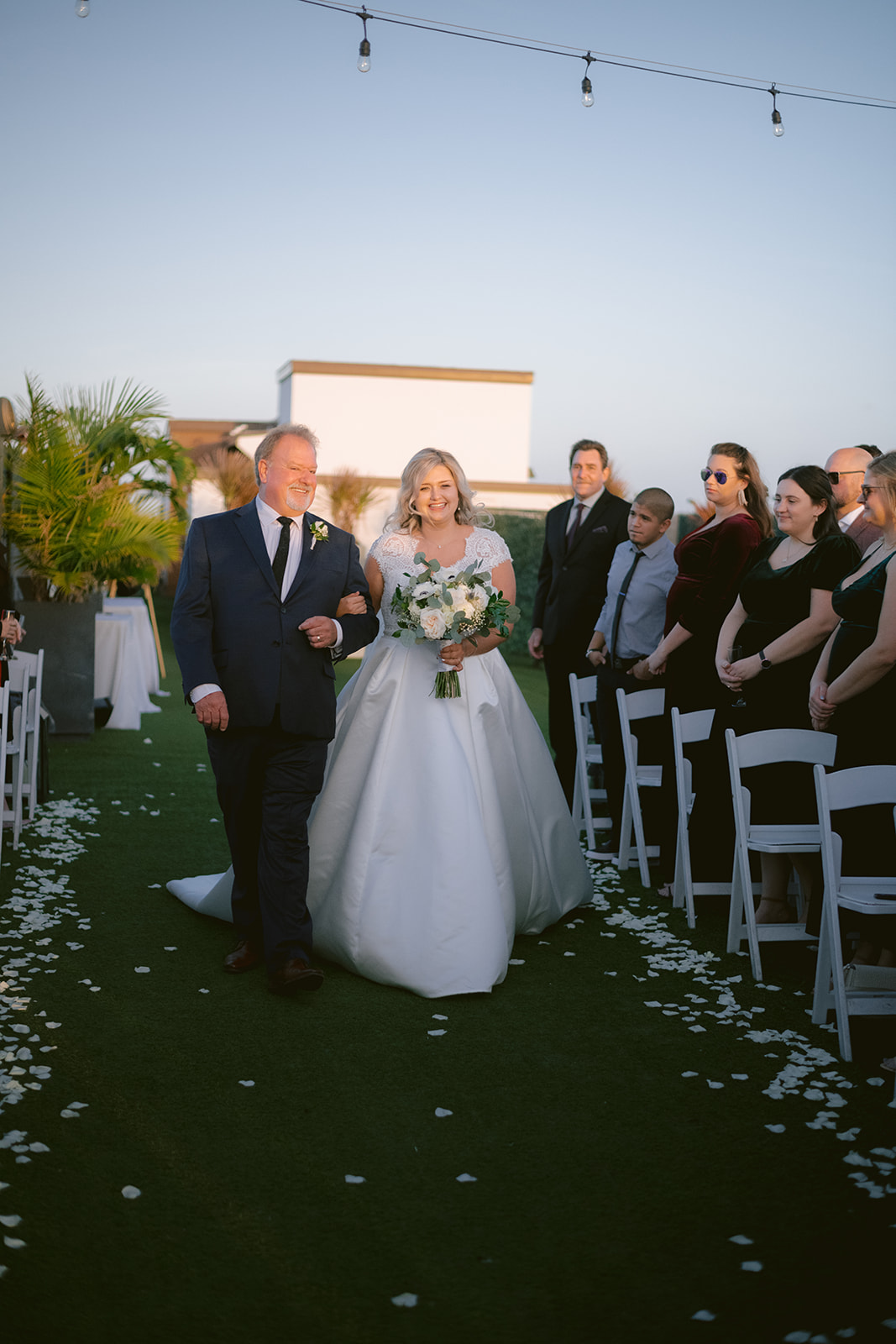 Hotel Zamora Wedding: Bride and Groom's Sweet Kiss by the Water

