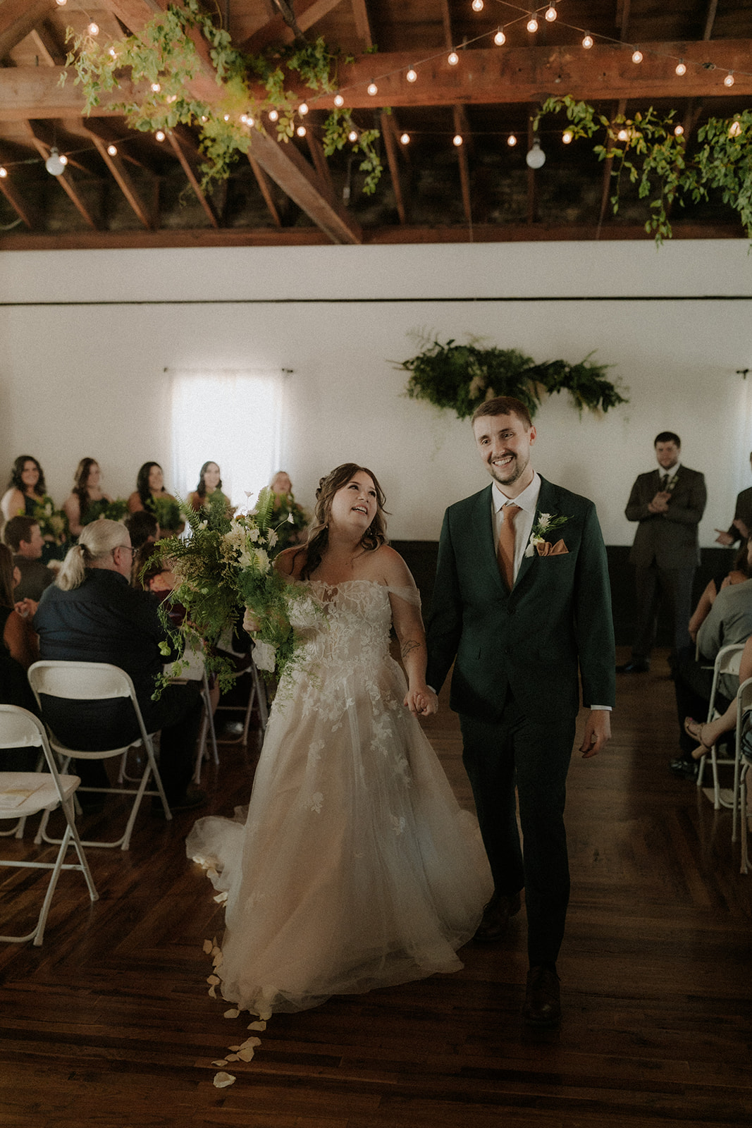 Creative documentary photographer capturing candid moments at the Baker Building wedding