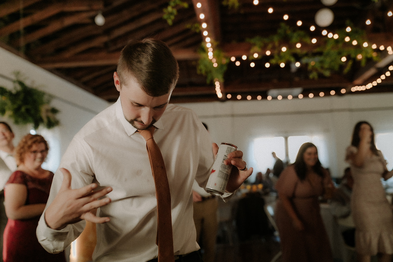 Creative documentary photographer capturing candid moments at the Baker Building wedding
