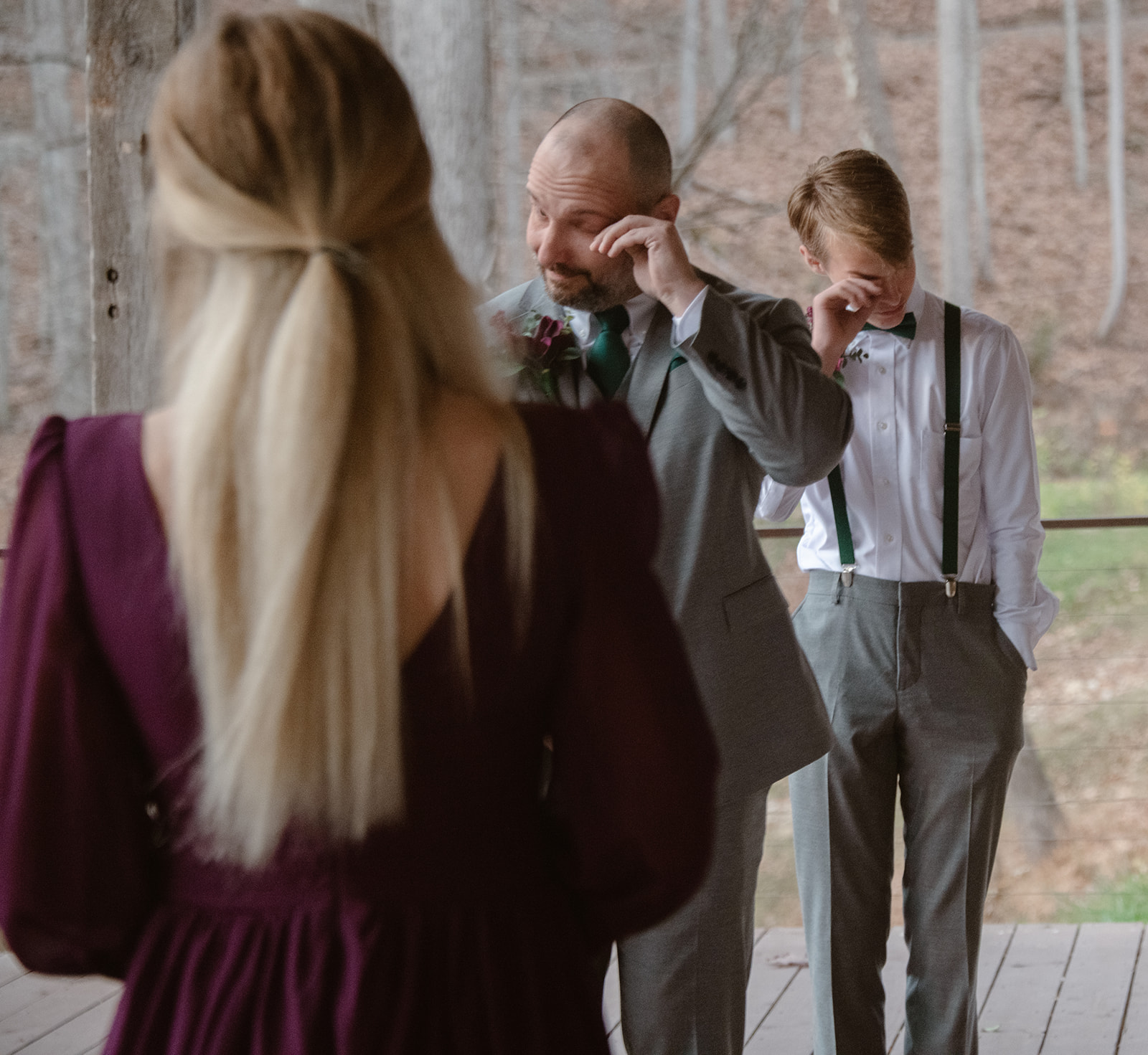 Groom and his son tear up with emotion as bride reaches the end of the aisle.