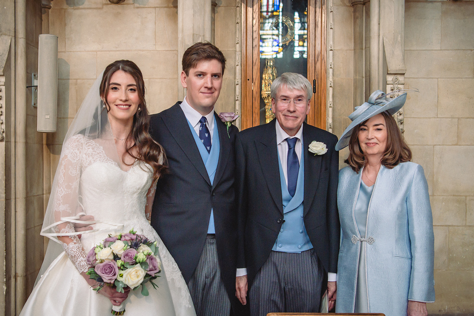 Portrait of Katherine and Damien with parents at the New College Chapel