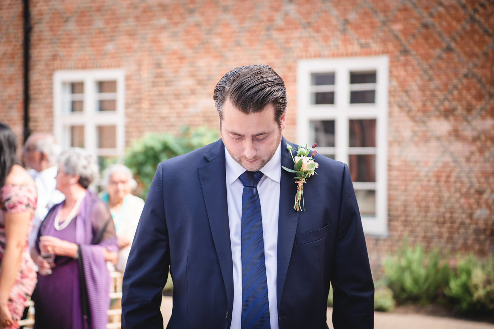 Chris waiting for the bride to enter wedding venue at the Fulham Palace