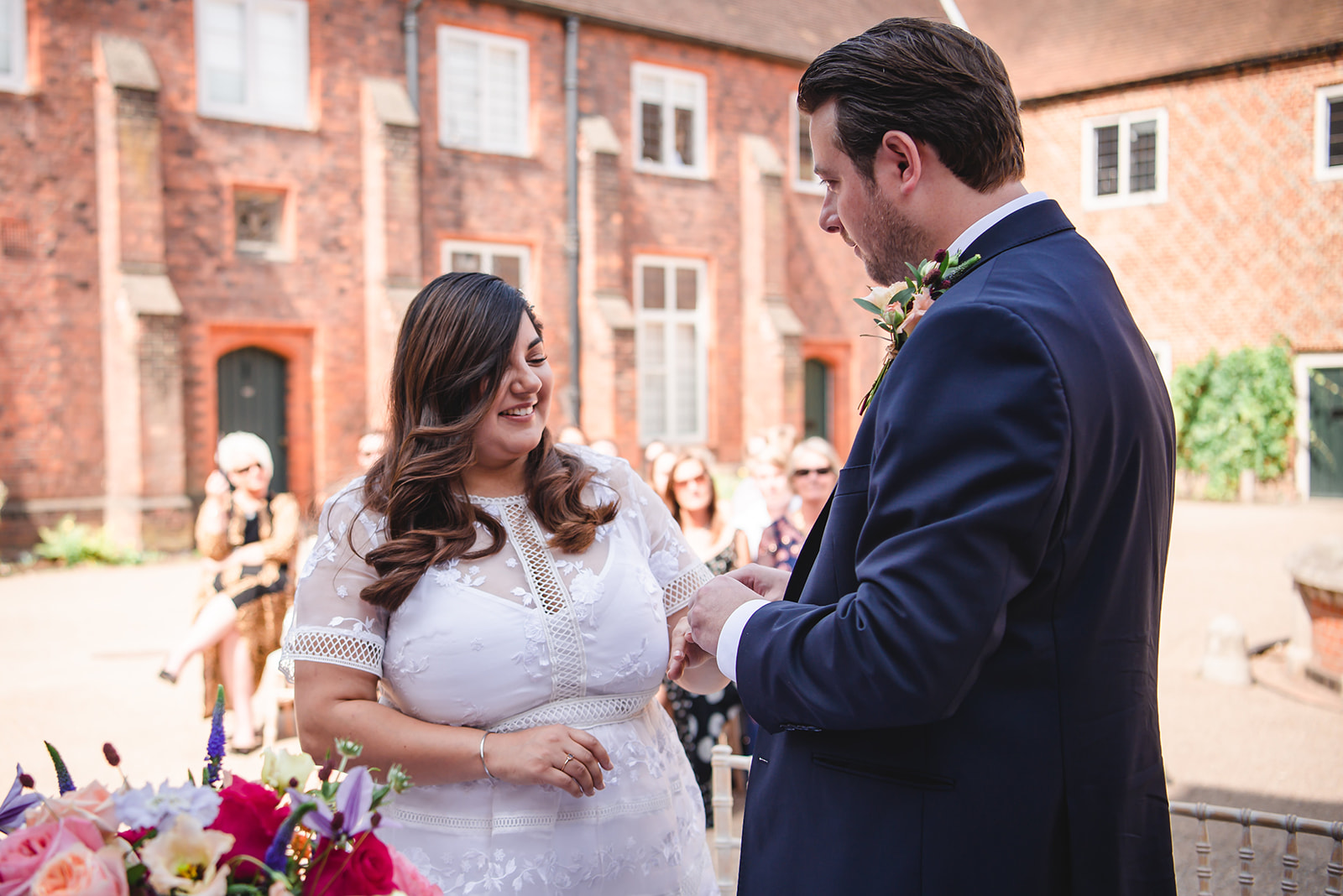 Nikita and Chris's  ring exchange during the wedding ceremony at the Fulham Palace