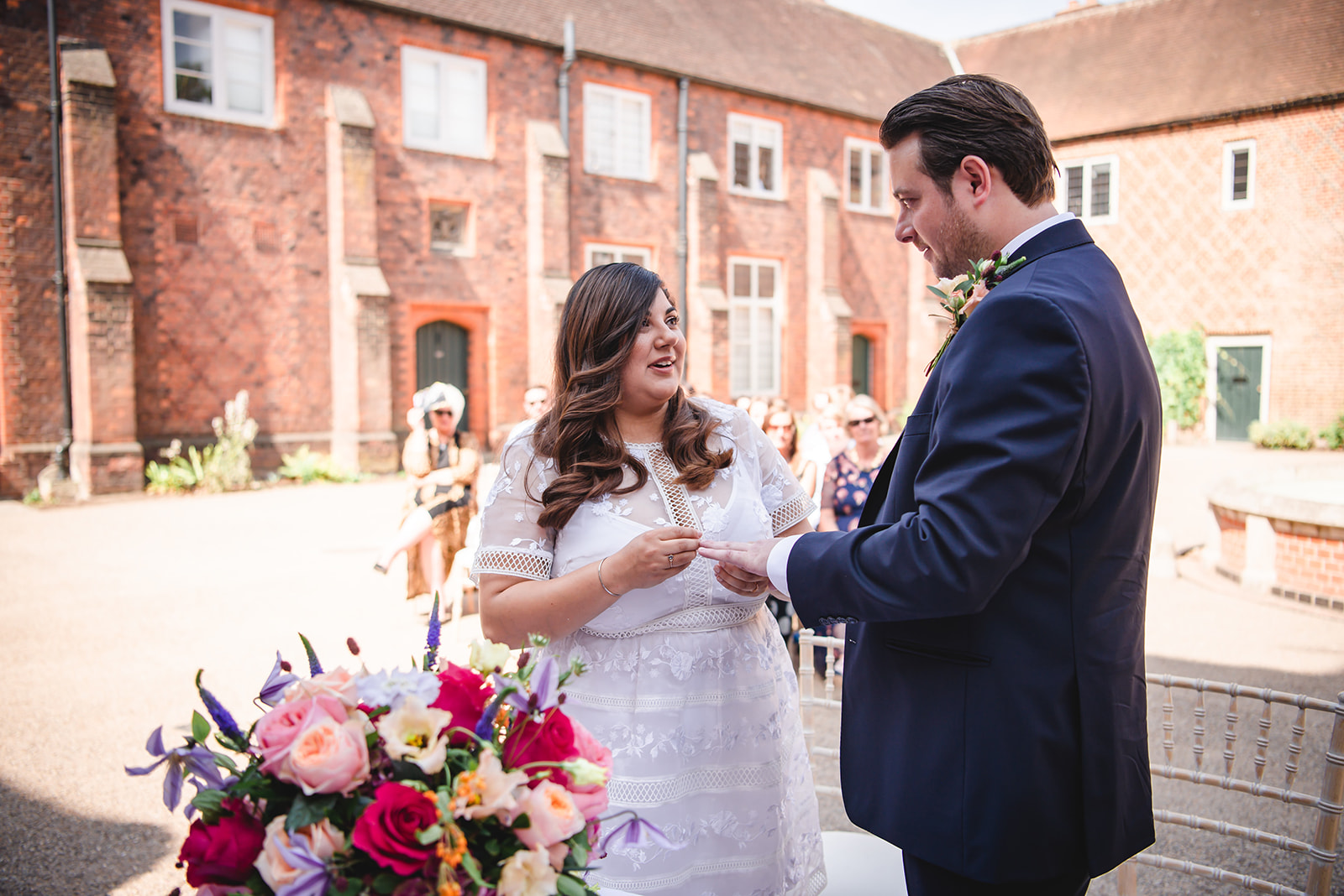 Nikita and Chris's  ring exchange during the wedding ceremony at the Fulham Palace