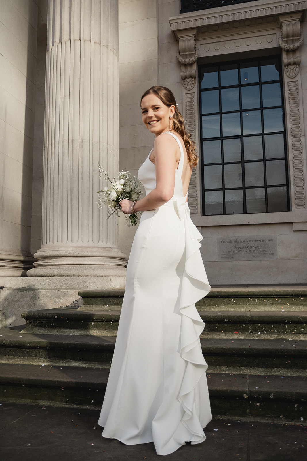 bride's beautiful portrait on the steps of Marylebone Town Hall