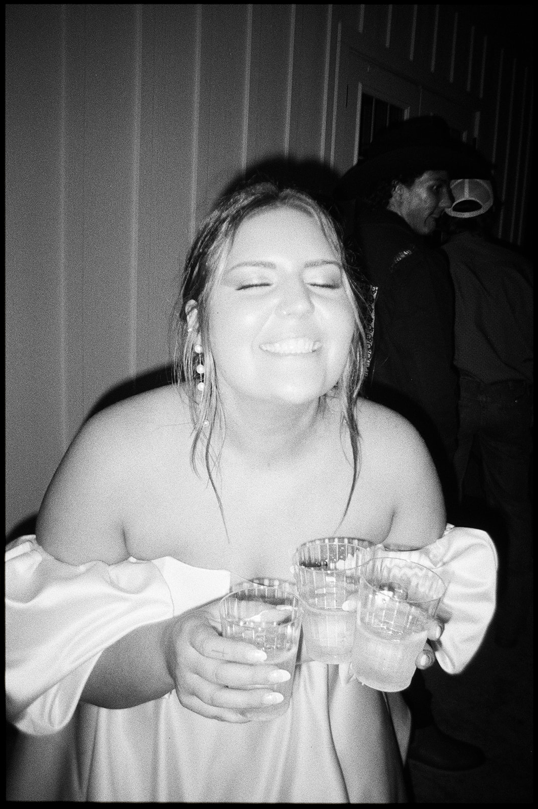 disposable camera of bride holding drinks
