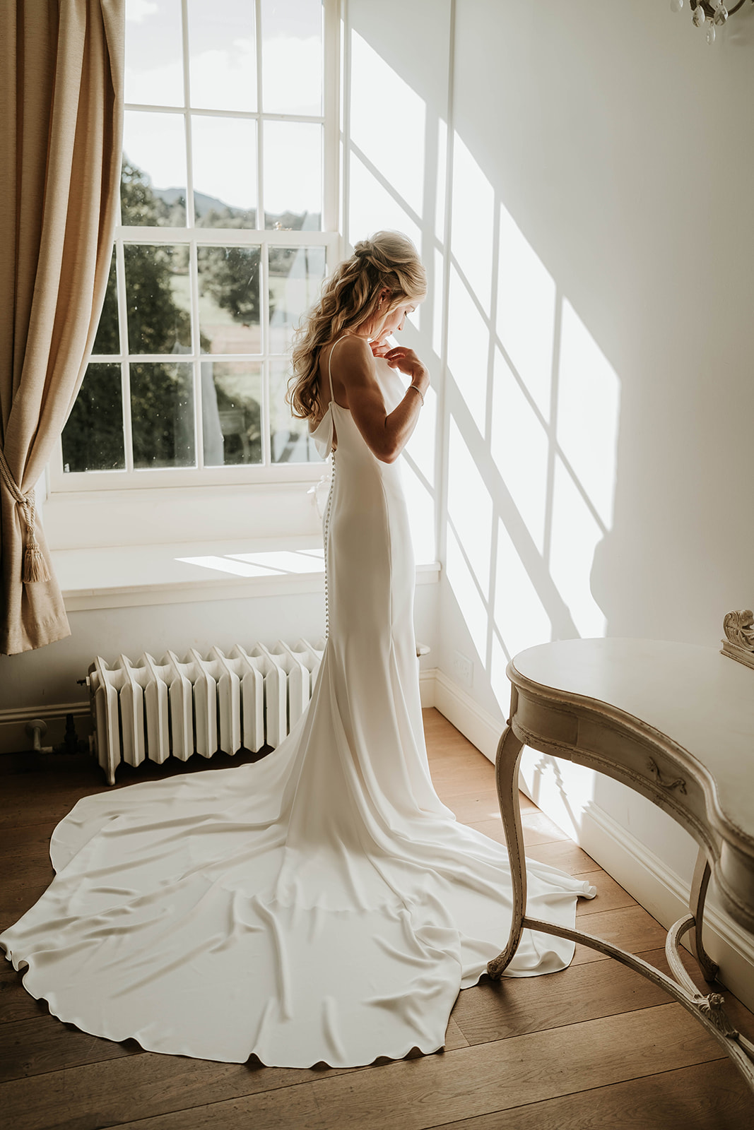 A BRIDE GETTING READY ON THE MORNING OF HER WEDDING AT LOGIE COUNTRY HOUSE