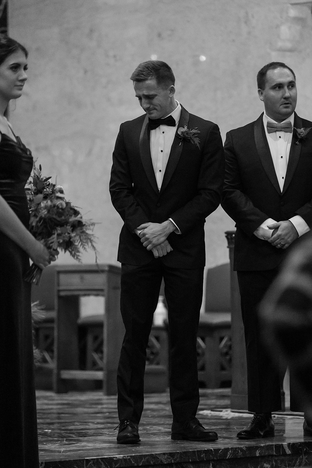 Groom crying at the end of the aisle 