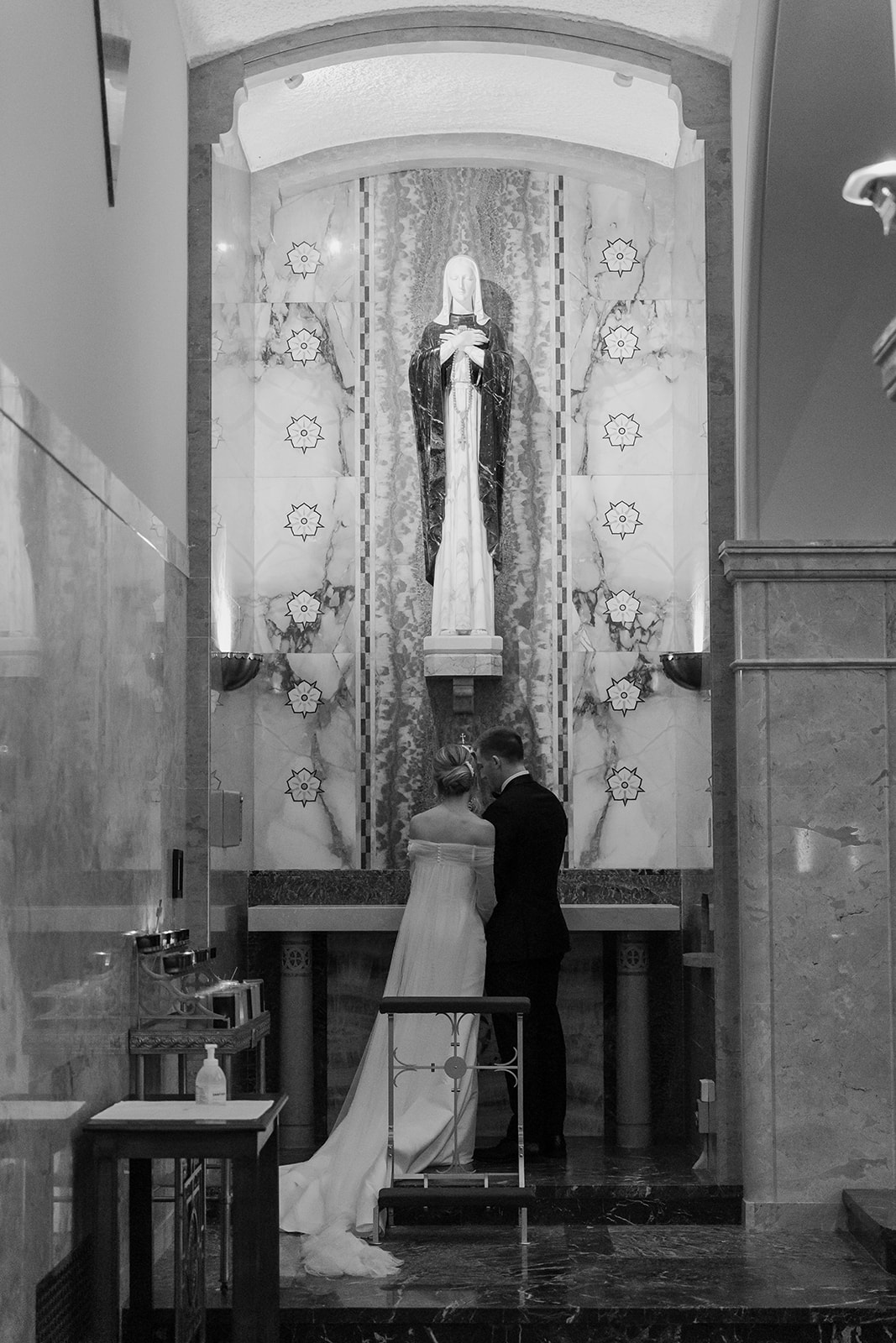 Bride and groom standing at the front of a church
