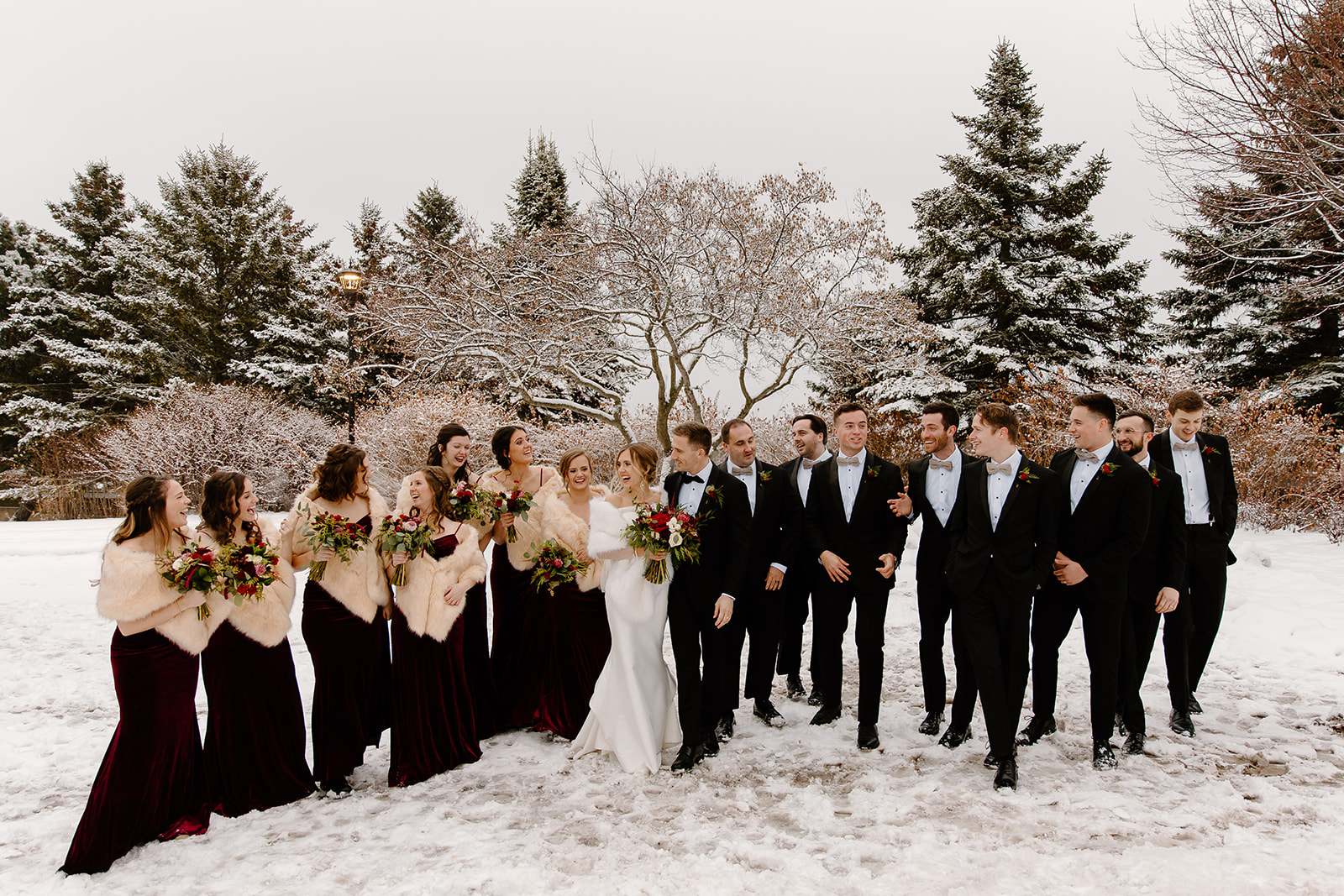 Wedding party outside in a snowstorm