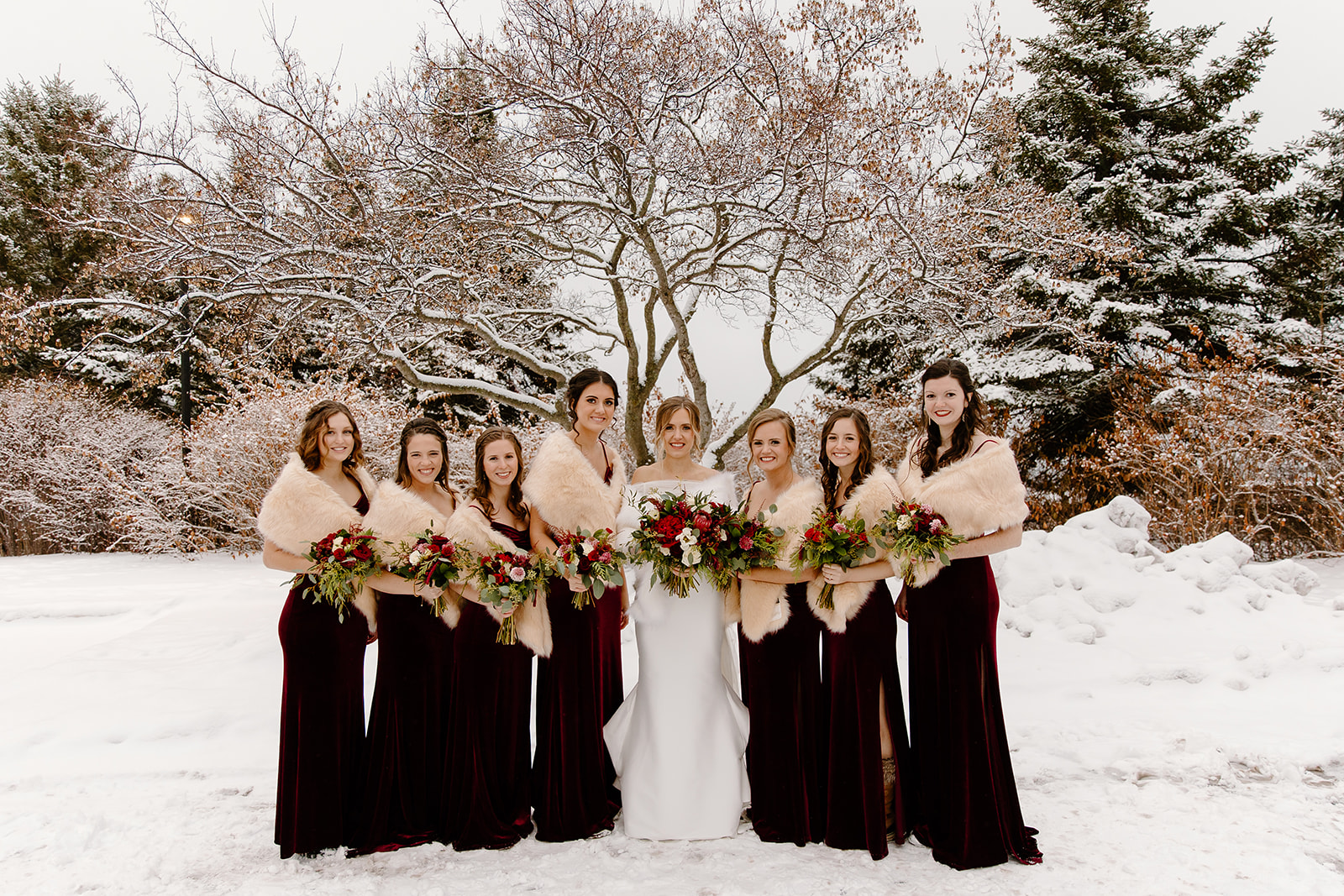 Bridesmaids outside in a snowstorm