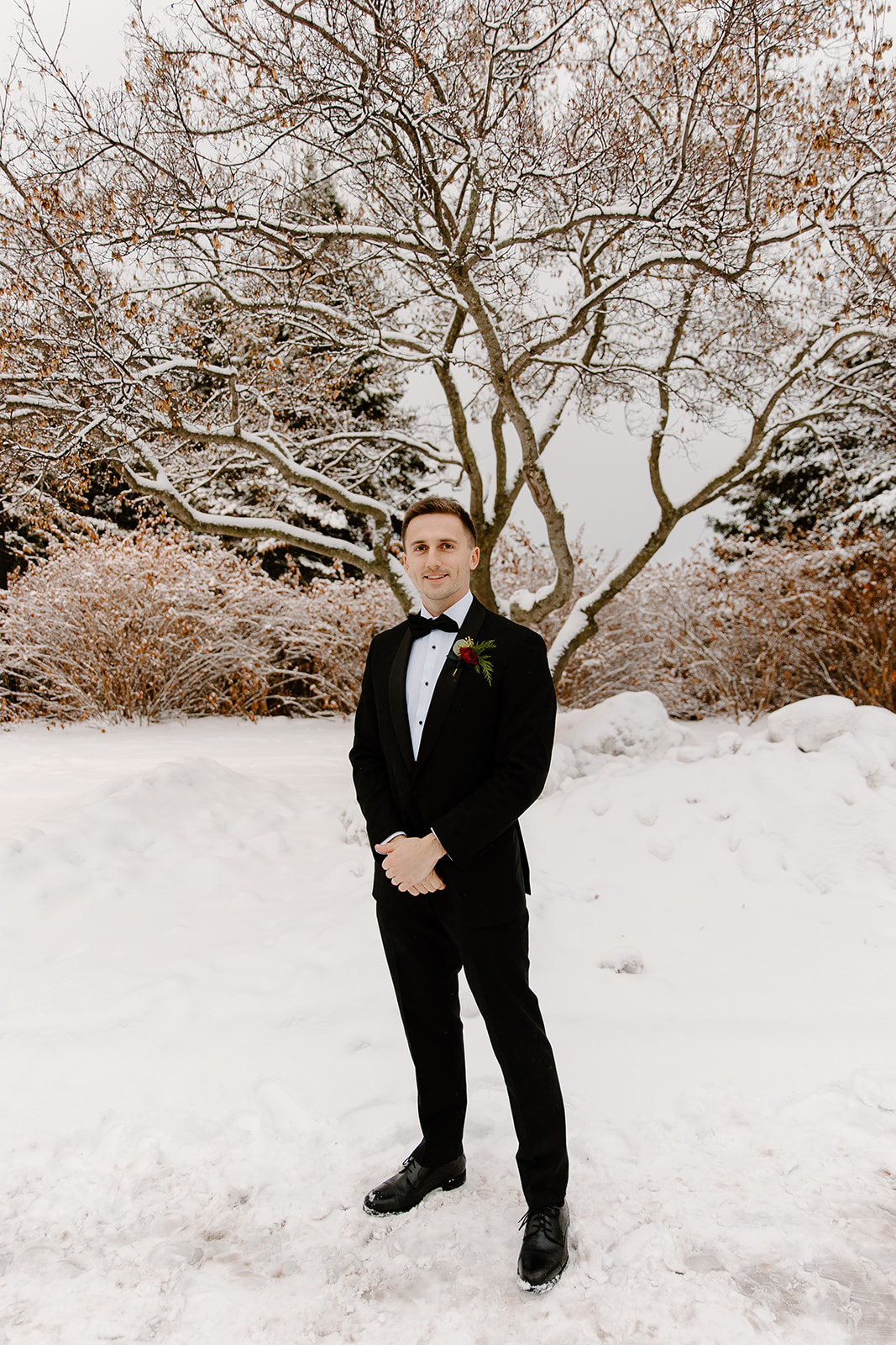 Groom outside in a snowstorm