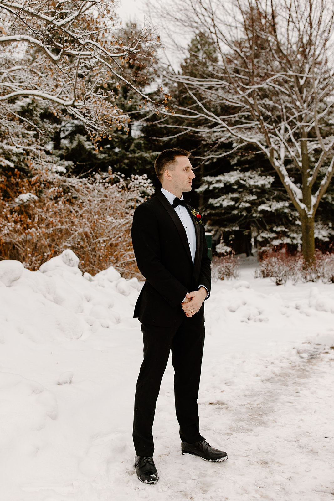 Groom outside in a snowstorm