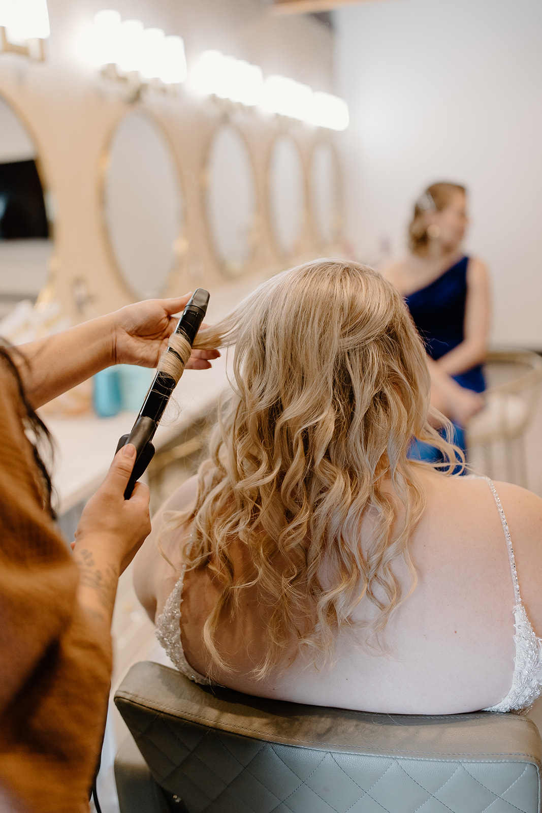 Bride getting her hair curled