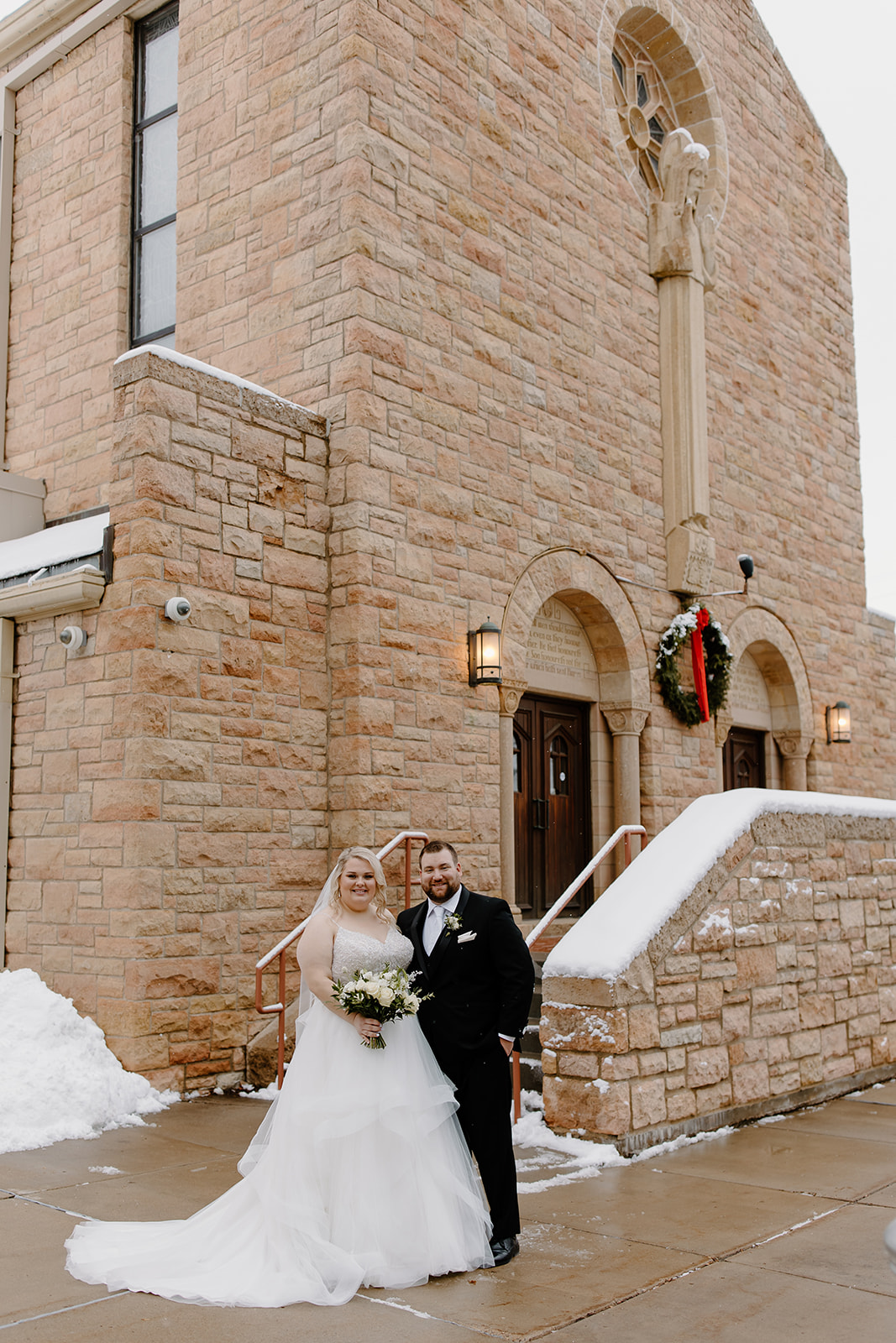 Bride and groom in front of a church 