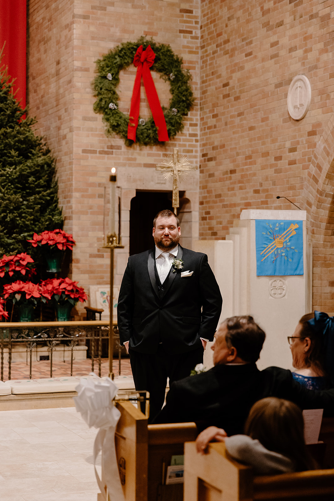 Groom at the end of the aisle