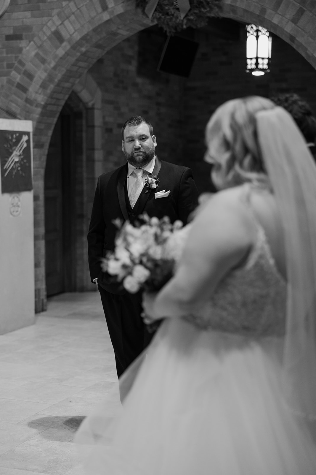Groom looking at his bride