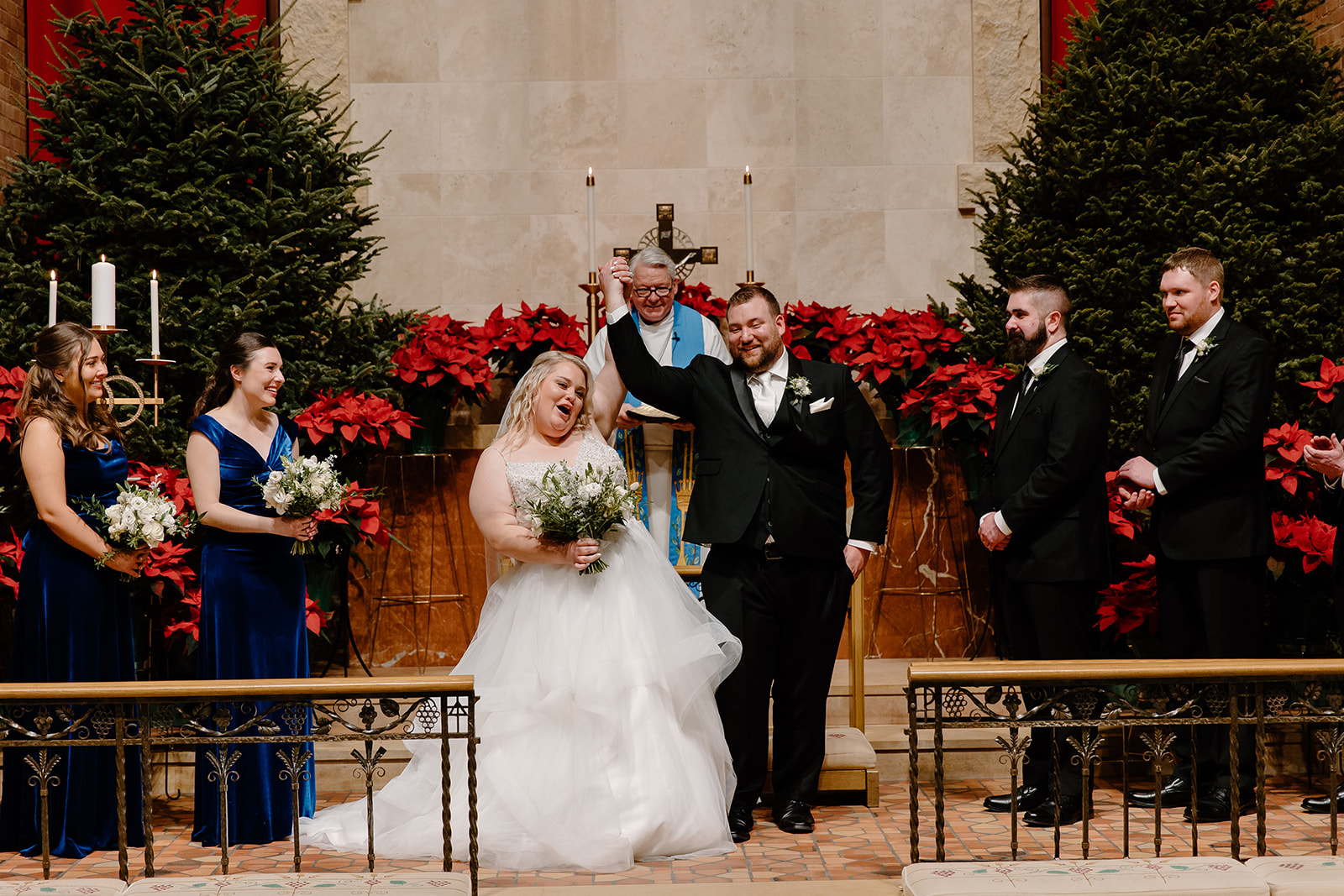 Bride and groom cheer in church during wedding ceremony