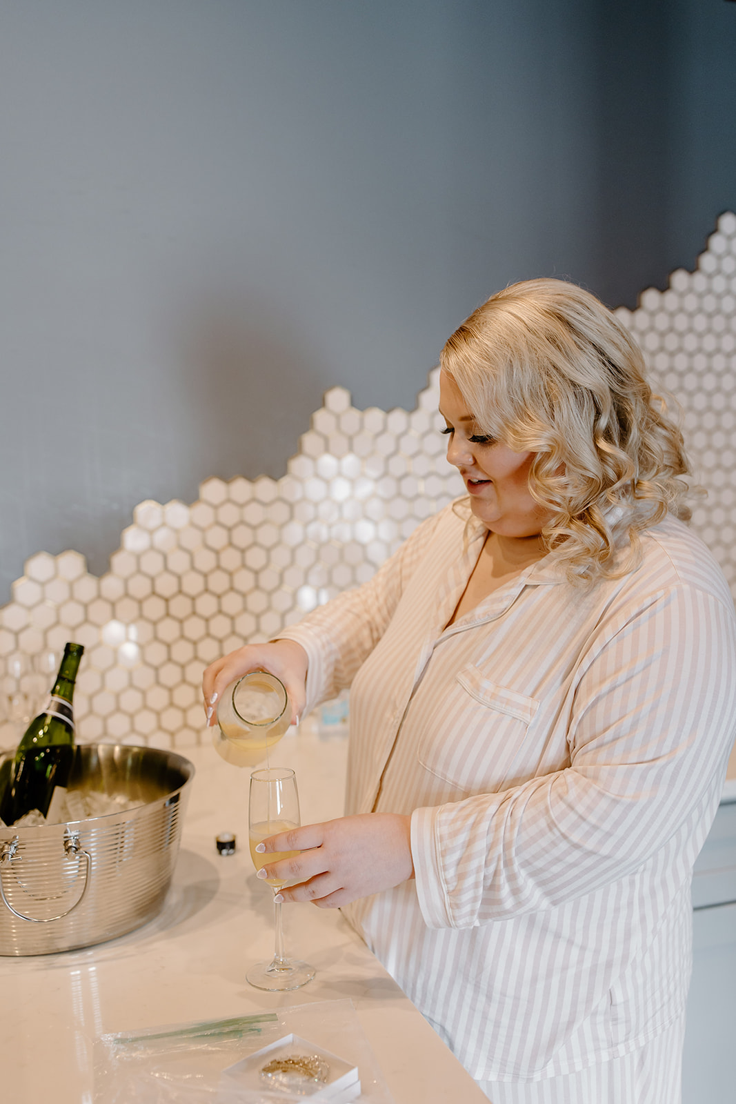 Bride pouring a glass of champagne