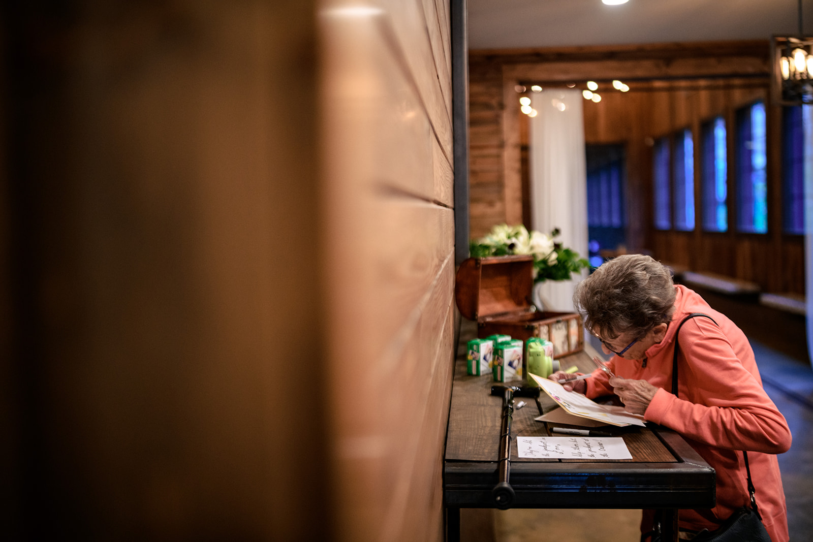 grandmother writing a letter to her daughter on wedding day