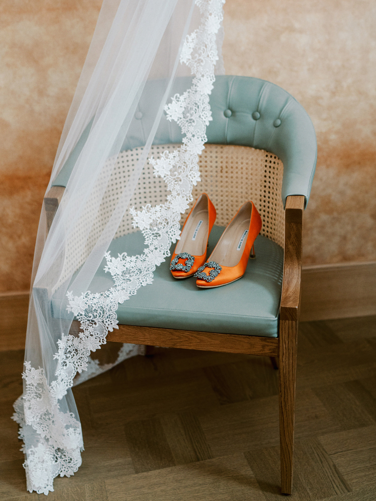 Manolo Blahnik orange shoes and wedding detail while getting ready at at Sommerro House Oslo for wedding