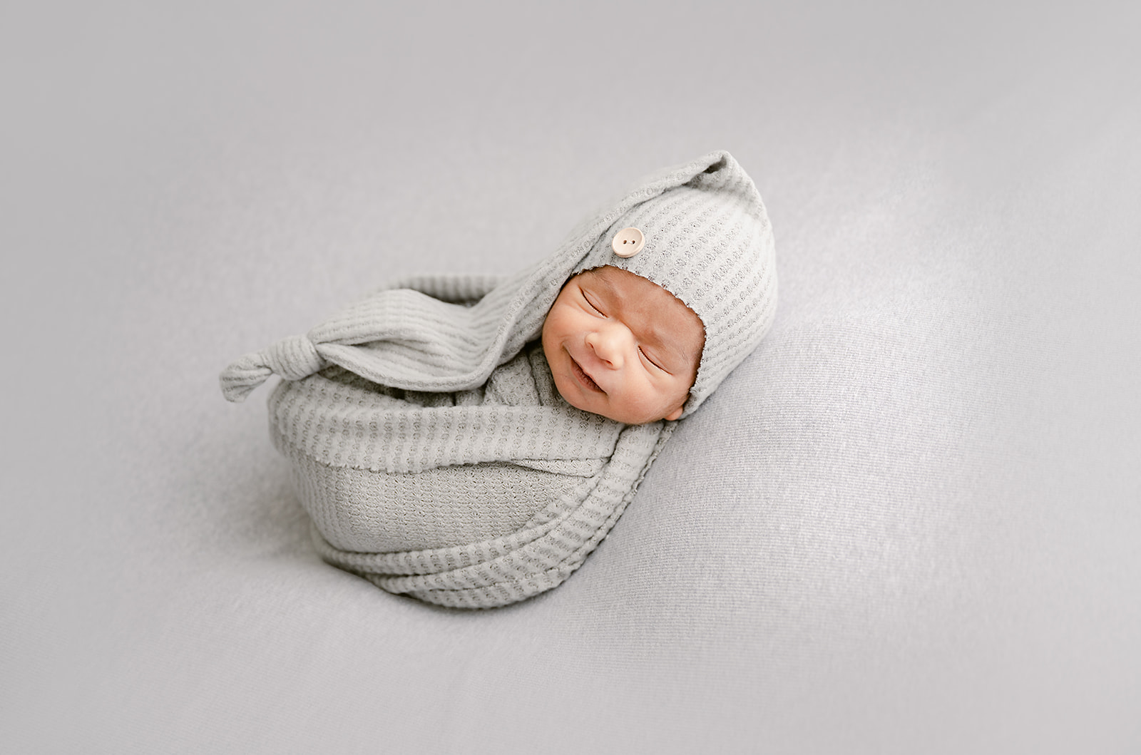 Smiling Baby | Princeton MN Newborn Photography Studio | Safety Certified Newborn Photographer with 10 years experience