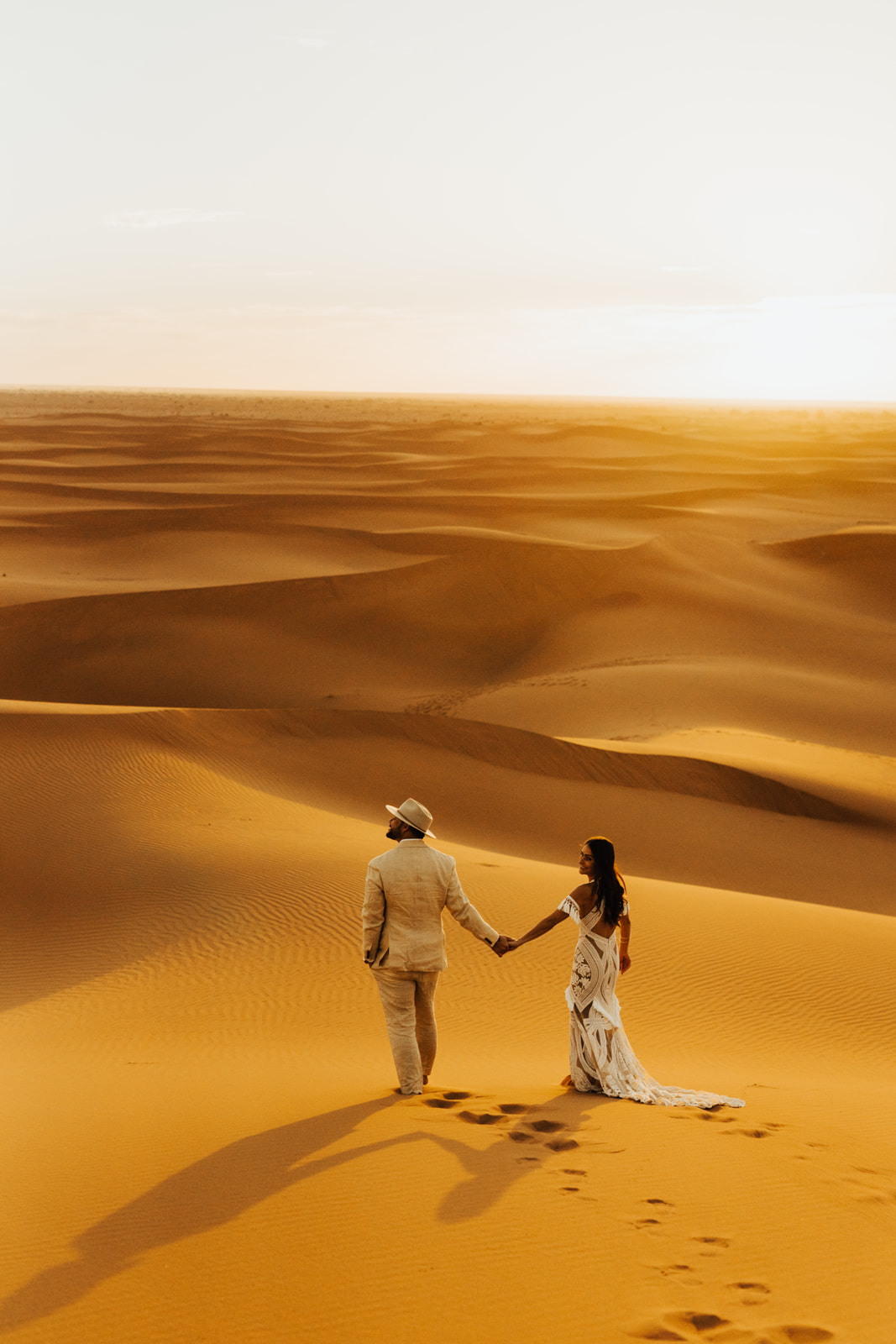 Sunrise elopement in the Sahara Desert, where to elope in the Sahara Desert wearing Rue De Seine gown