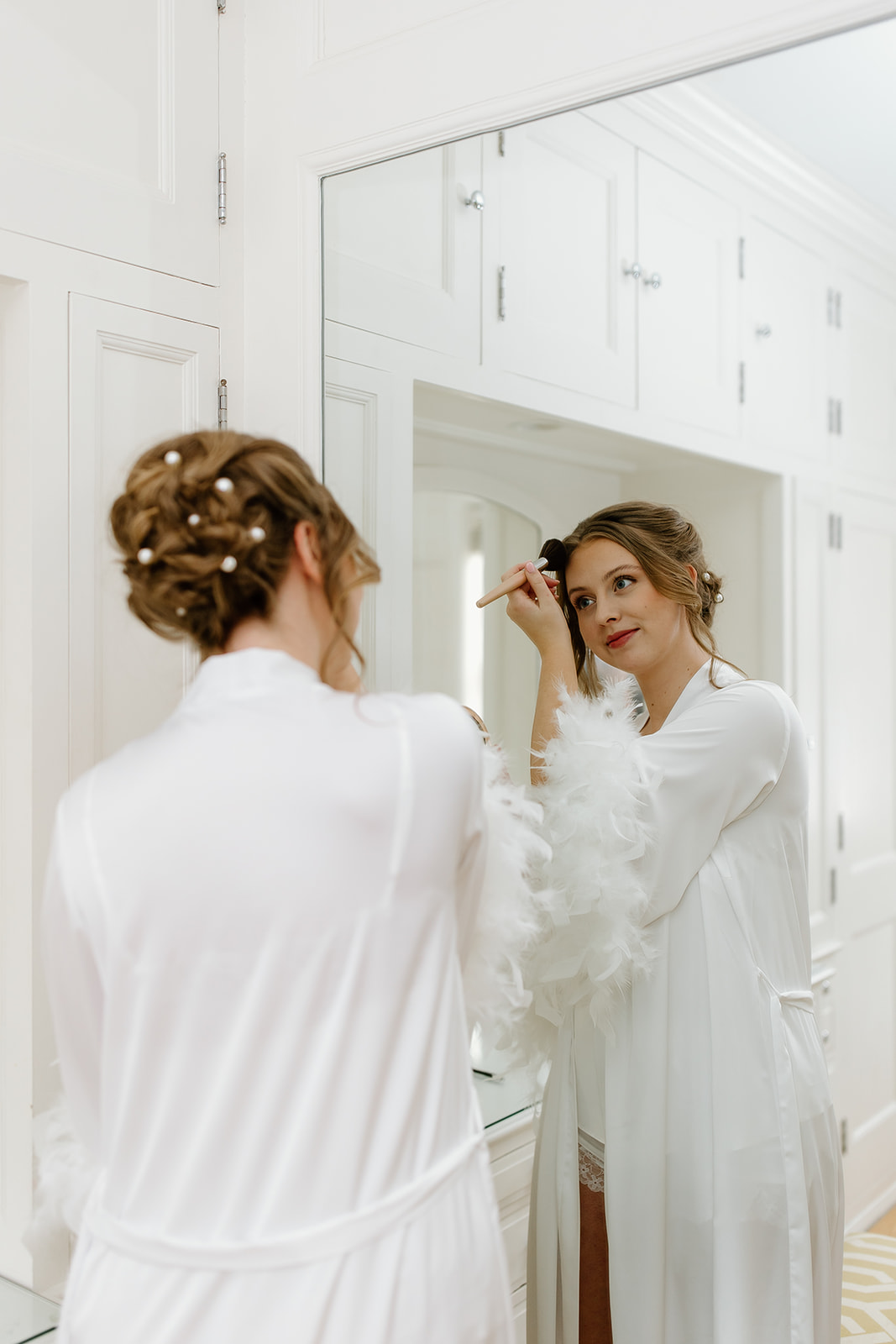 Bride getting ready in mirror