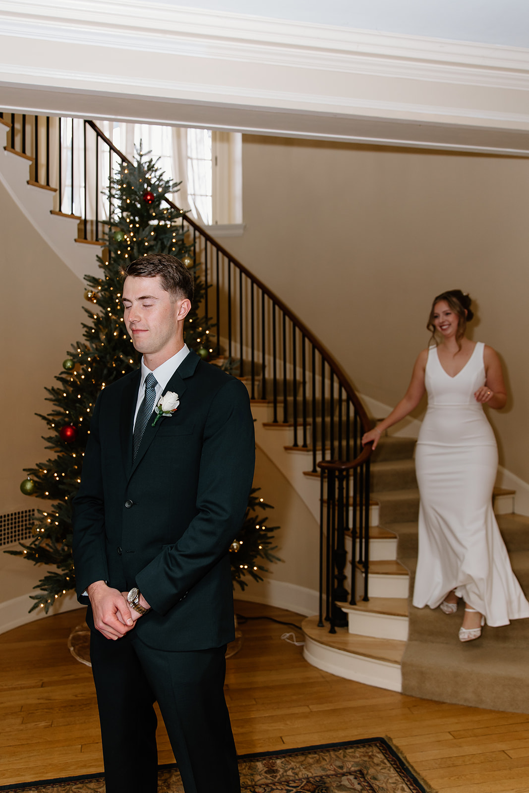 Bride walks down spiral staircase to her groom