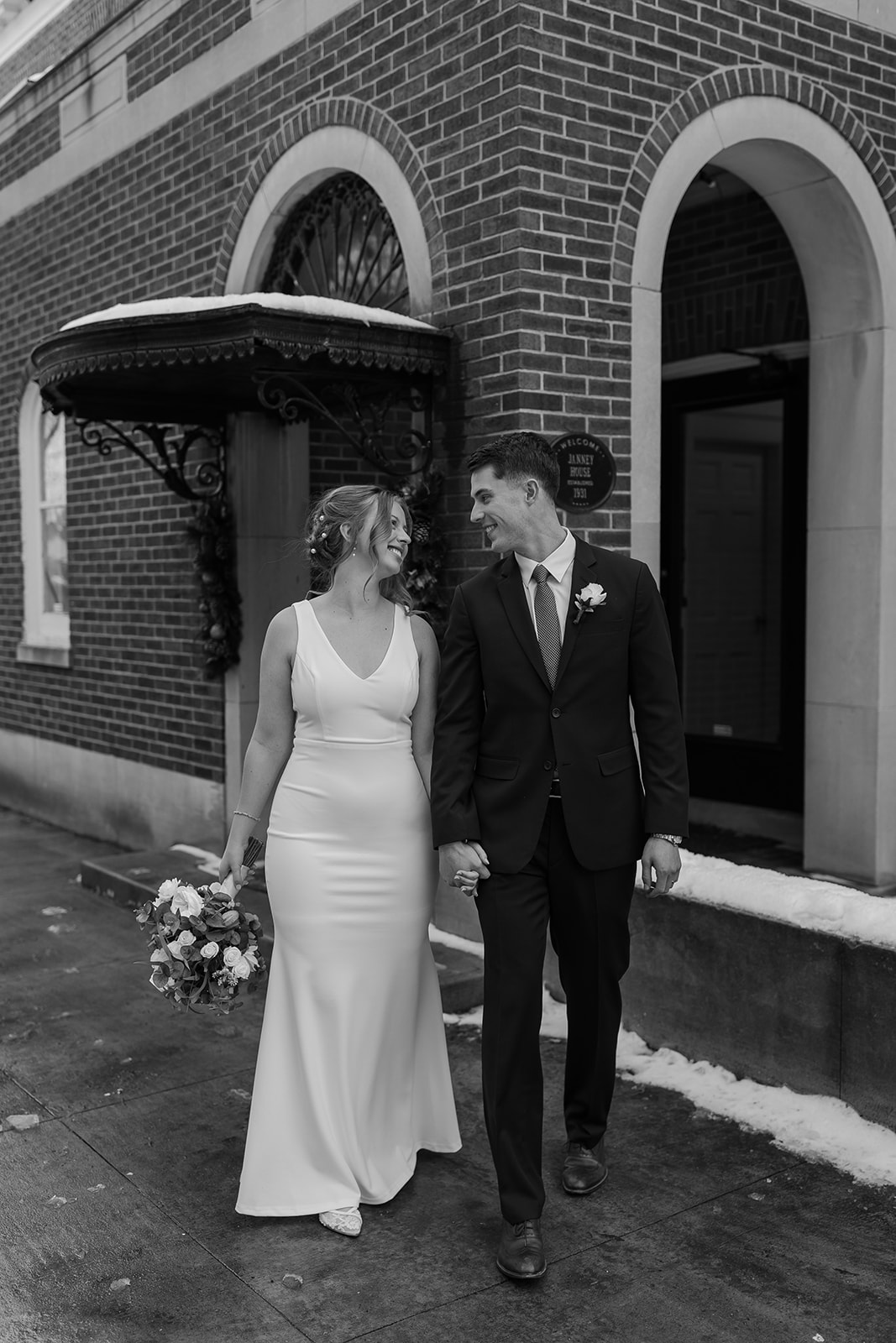 Bride and groom in front of old historic home
