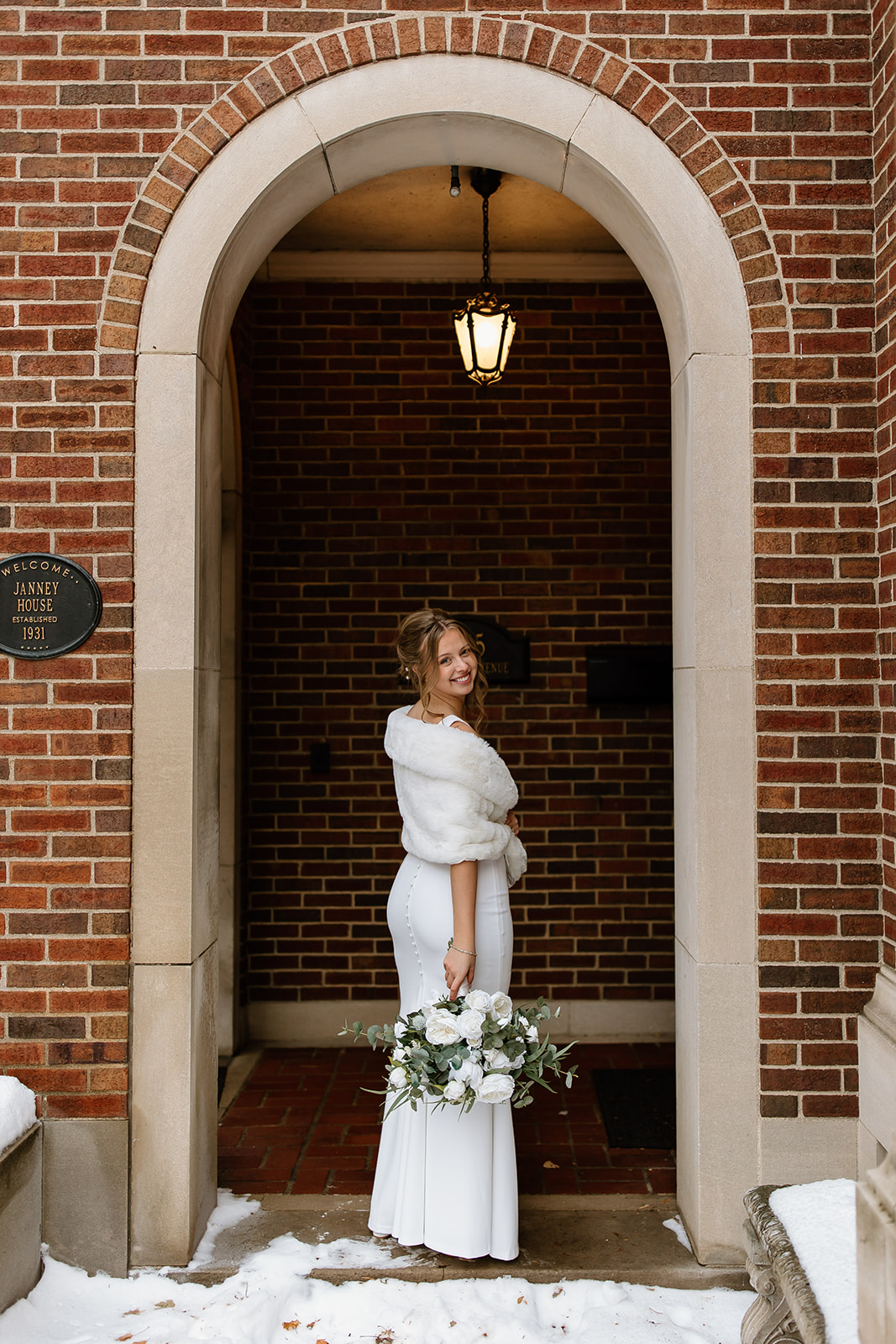 Bride in front of old historic home