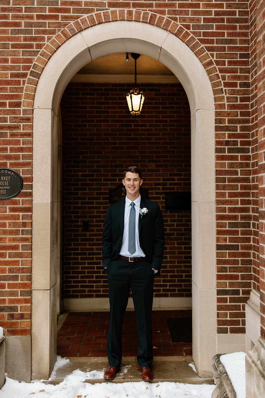 Groom in front of old historic home