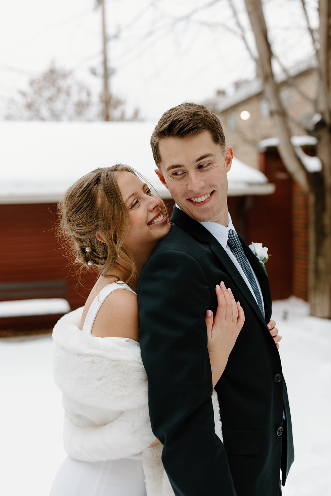 Bride and groom outside in the snow