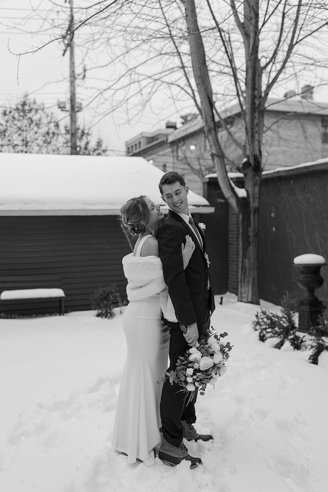 Bride and groom outside in the snow