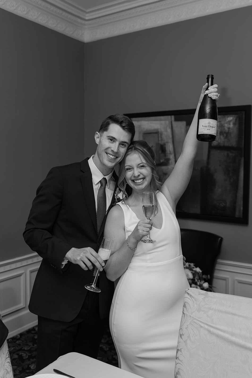 Bride and groom pouring champagne 