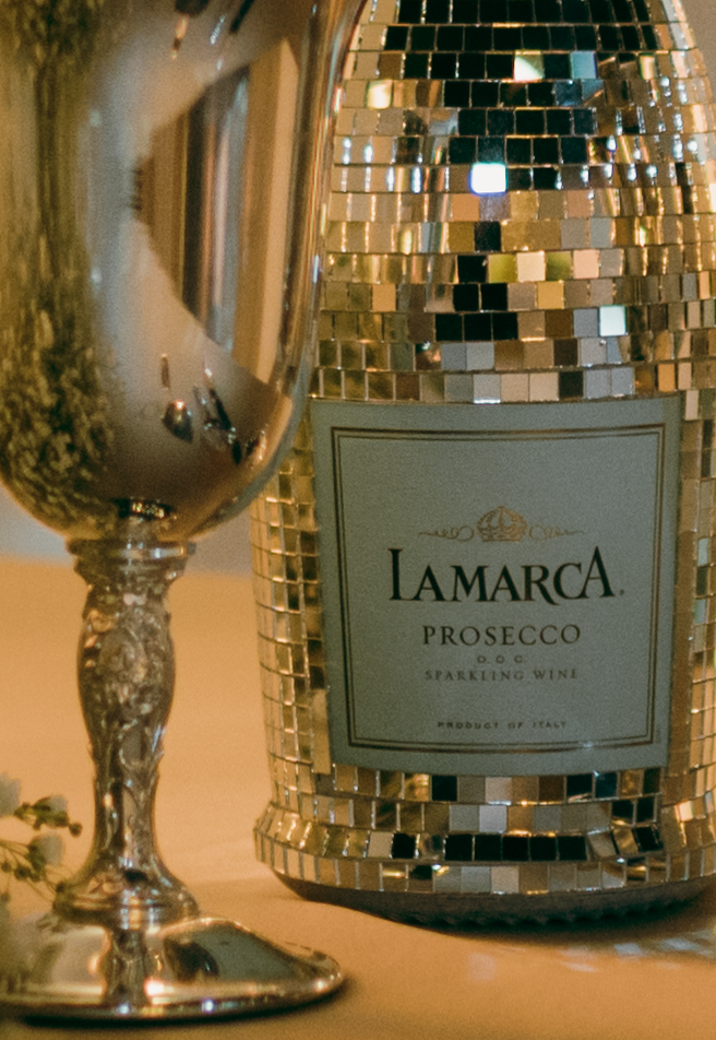 The couple was gifted a custom disco bottle of Lamarca champagne.