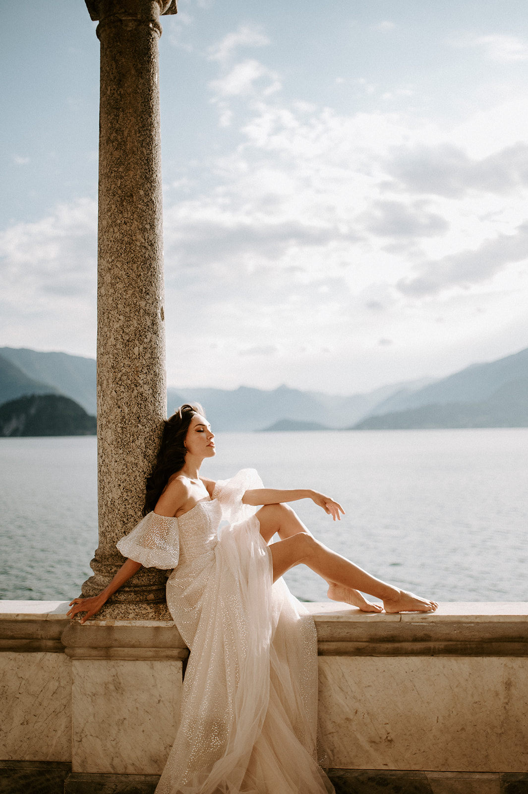 bride sitting looking out at views of lake como