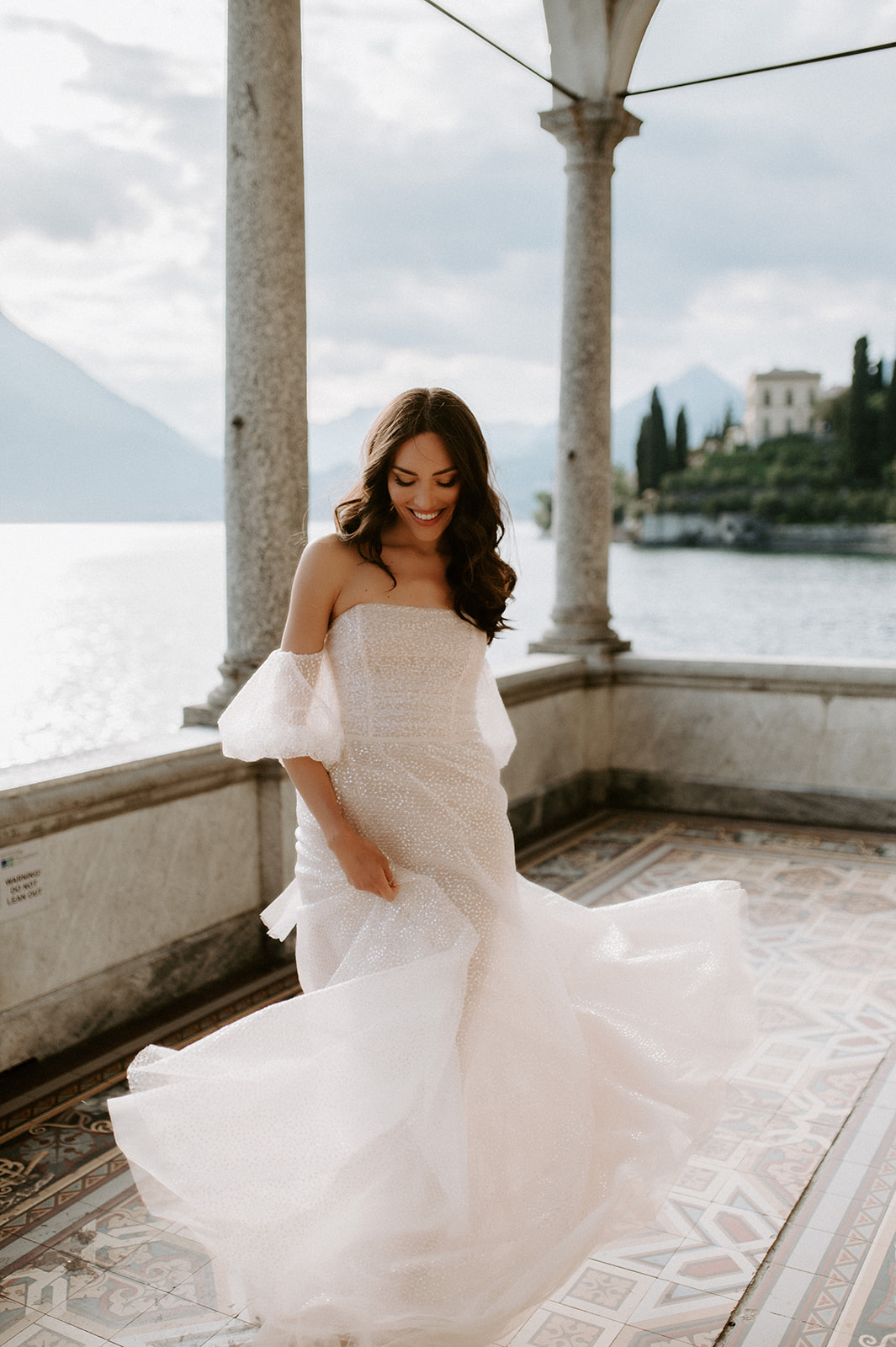 bride playing with dress jolie by berta lake Como at villa monastero