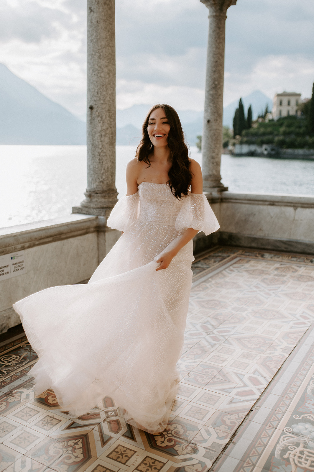 bride playing with dress jolie by berta lake Como at villa monastero