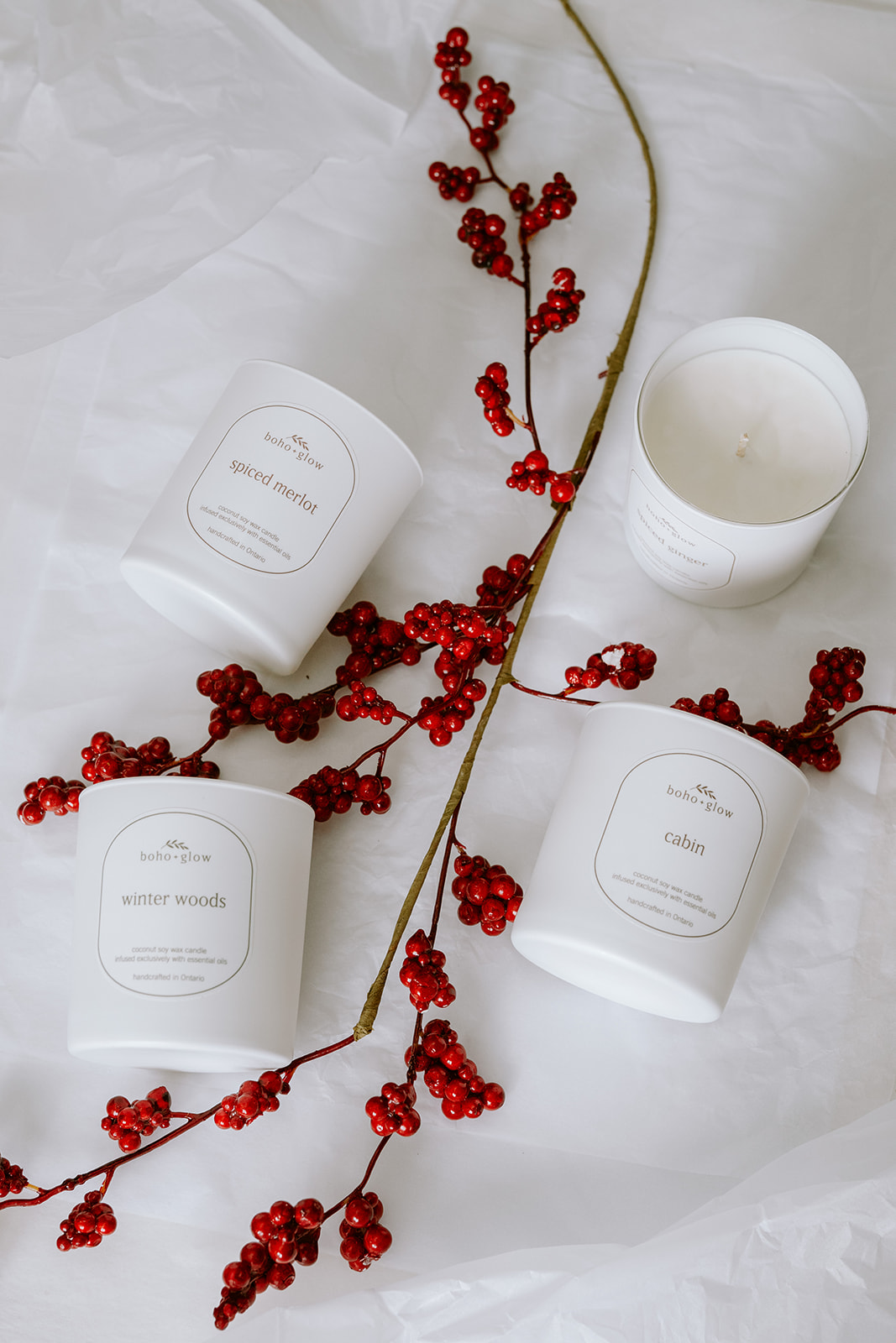 christmas candle flat lay with red berries